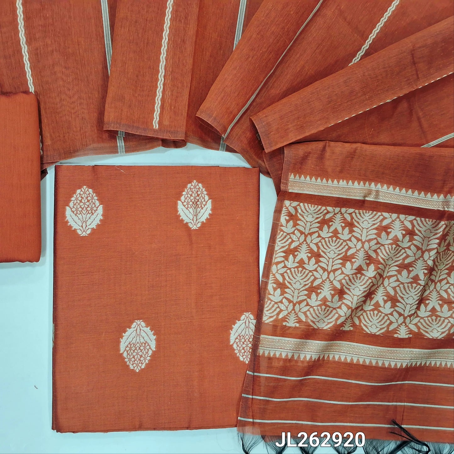Rust orange silk cotton unstitched salwar material, thread woven buttas all over,(lining needed)silk cotton bottom, weaving on silk cotton dupatta with thread woven pallu. JL262920