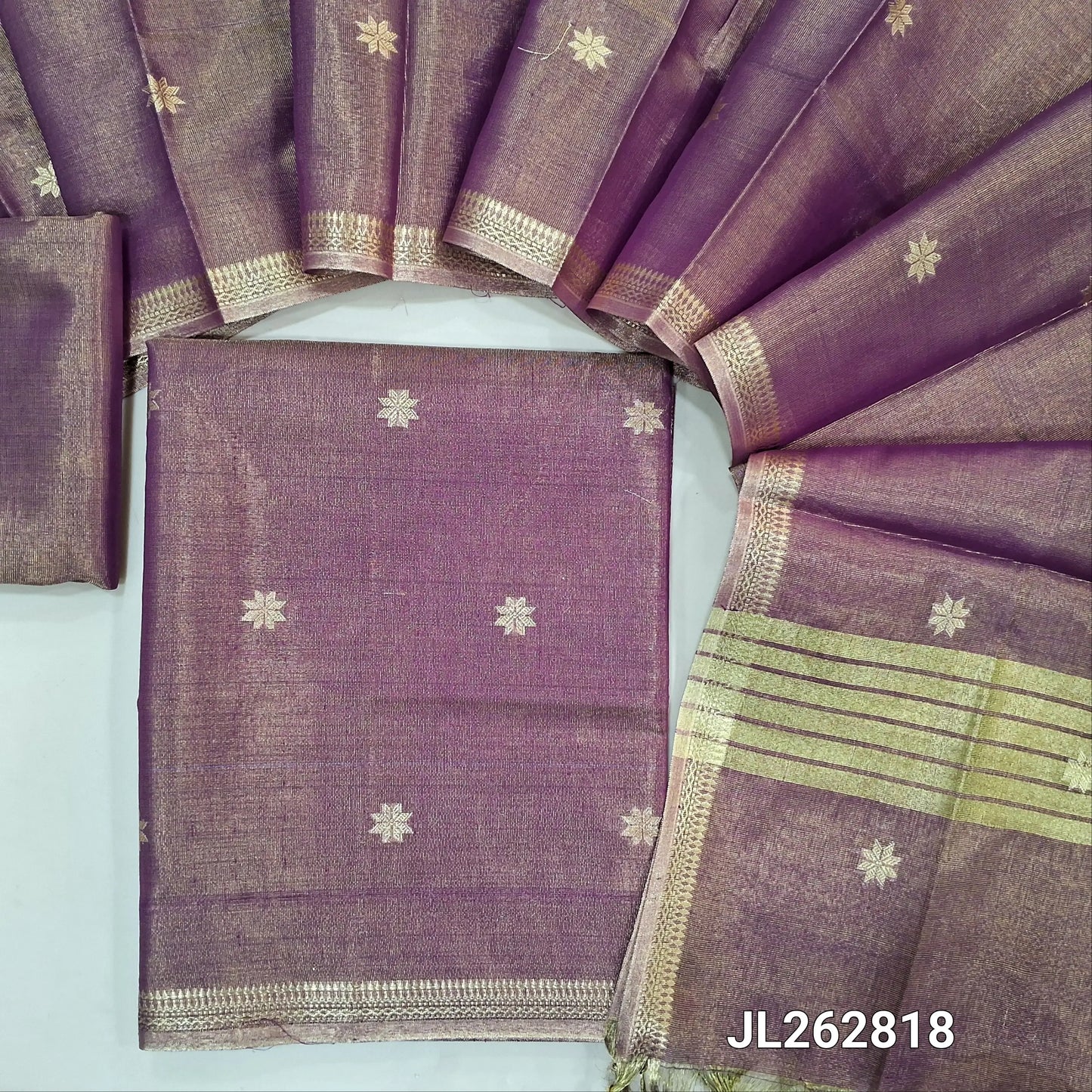 Pink with golden tint tissue silk cotton unstitched salwar material, zari buttas all over, zari daman borders, (silky, lining needed)tissue silk cotton bottom, zari buttas on tissue silk cotton dupatta with zari borders. JL262818