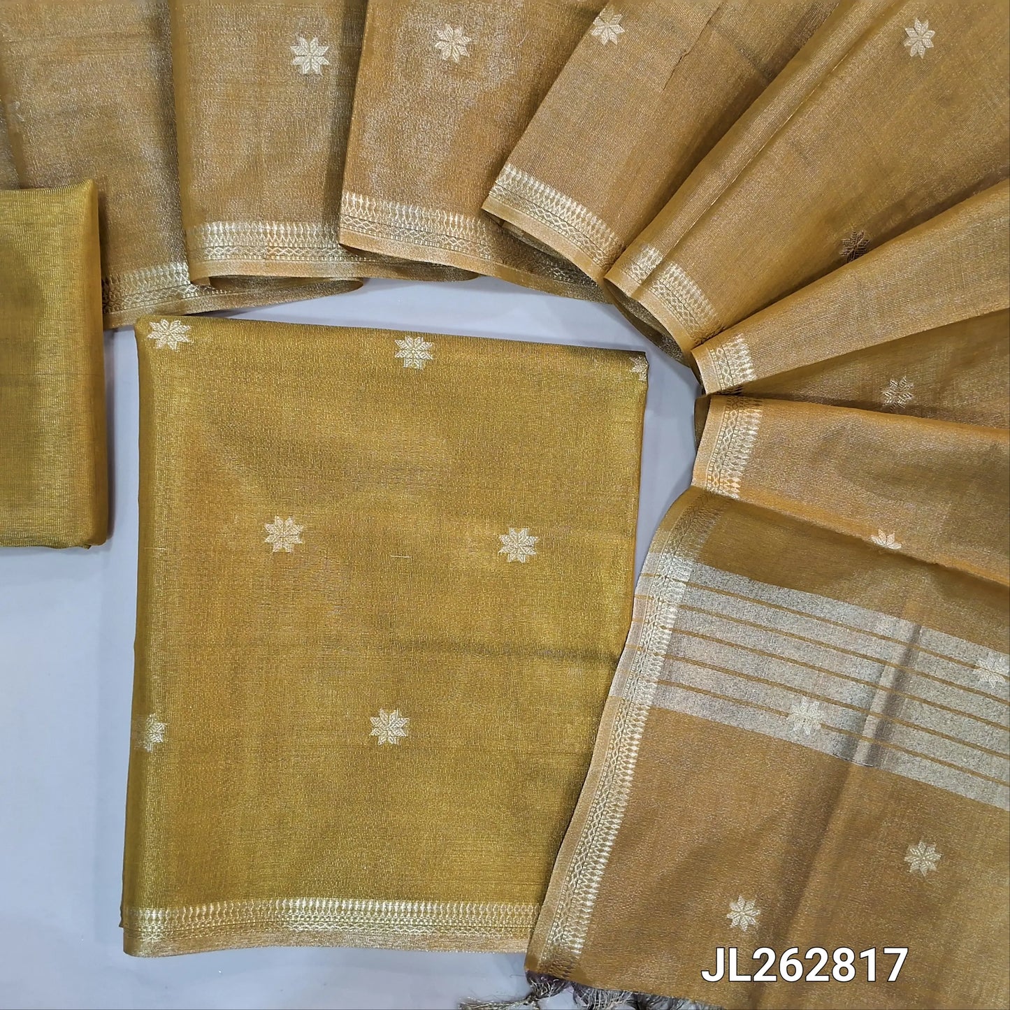 Golden yellow with golden tint tissue silk cotton unstitched salwar material, zari buttas all over, zari daman borders, (silky, lining needed)tissue silk cotton bottom, zari buttas on tissue silk cotton dupatta with zari borders. JL262817