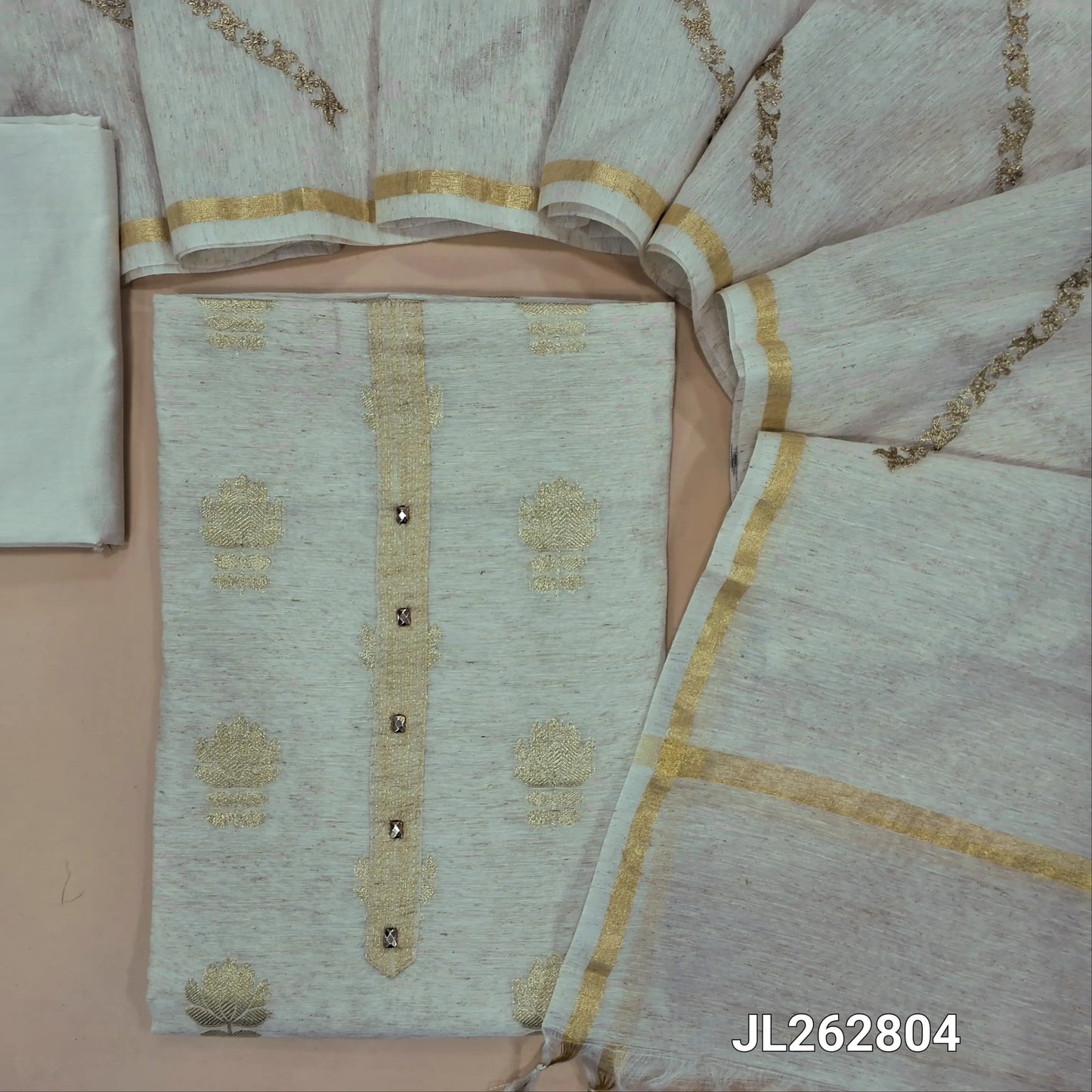 Off white slub silk unstitched salwar material,benarasi zari woven all over, simple yoke, (lining needed)silky bottom, zari embroidery onslub silk dupatta with tissue borders. JL262804