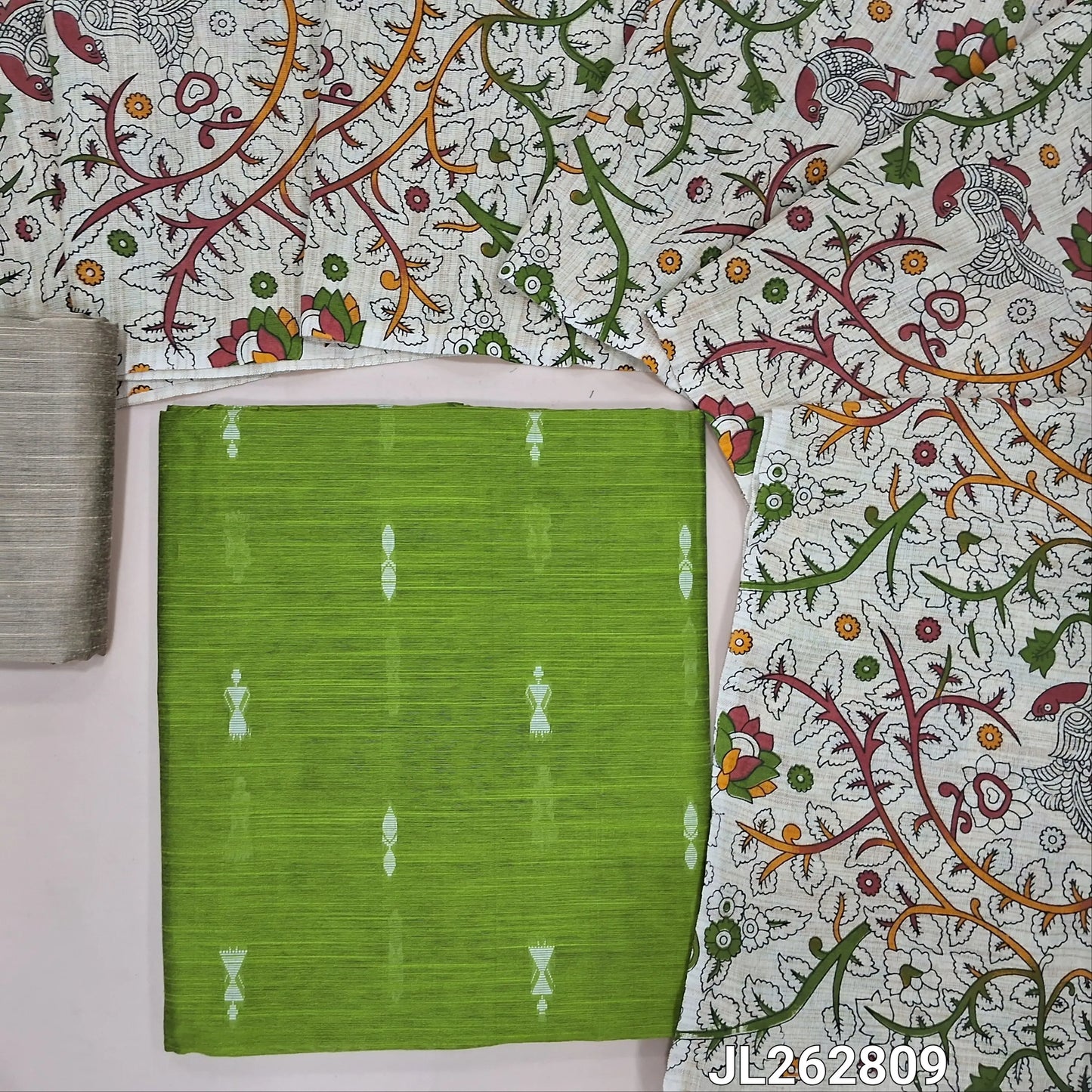 Green slub silk cotton unstitched salwar material, thread woven buttas all over,(textured,lining needed)beige silk cotton bottom, floral and peacock printed jute cotton dupatta. JL262809