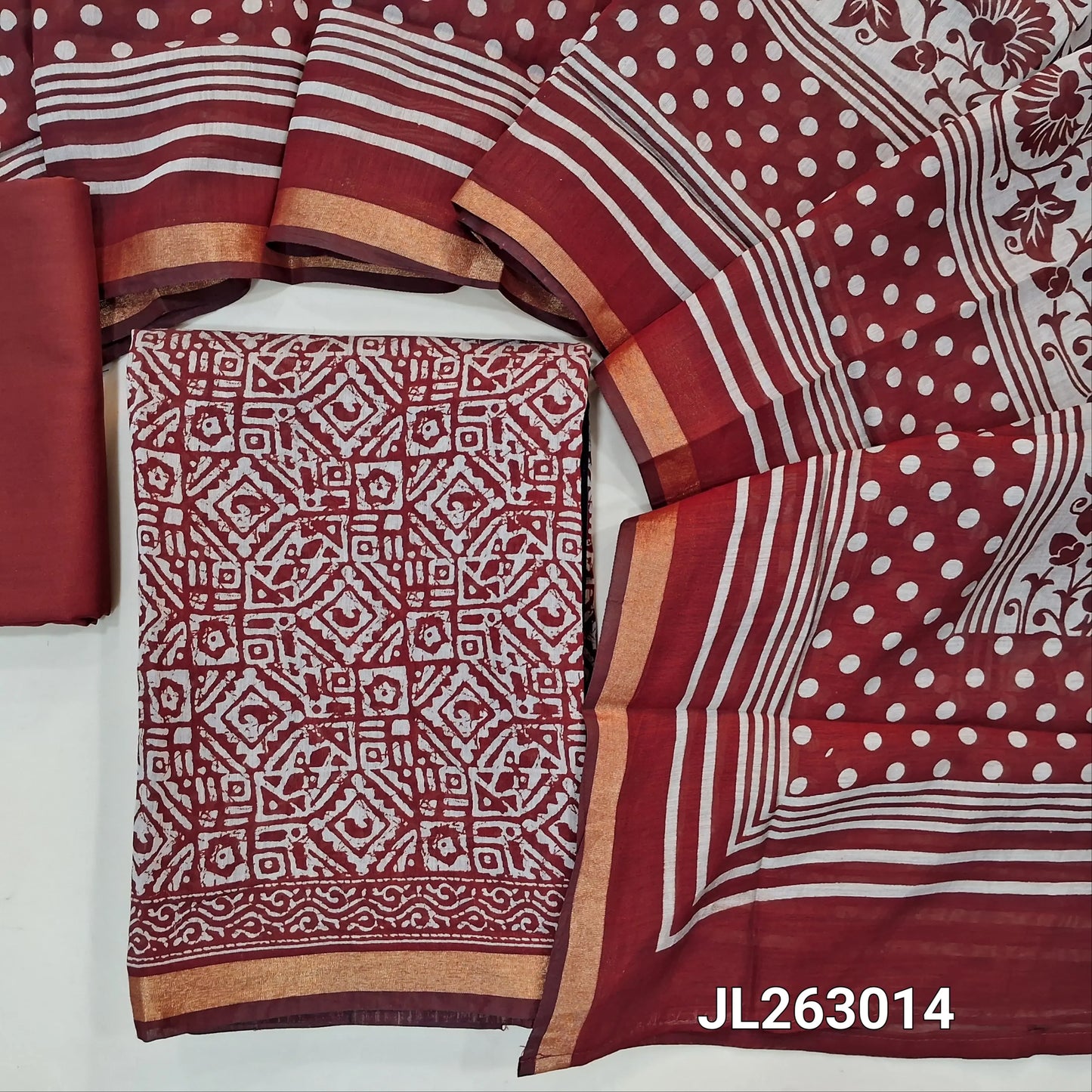 Reddish maroon silk cotton unstitched salwar material,batik design all over,zari borders,(lining needed)spun cotton bottom,printed full length soft silk cotton dupatta with tissue borders. JL263014