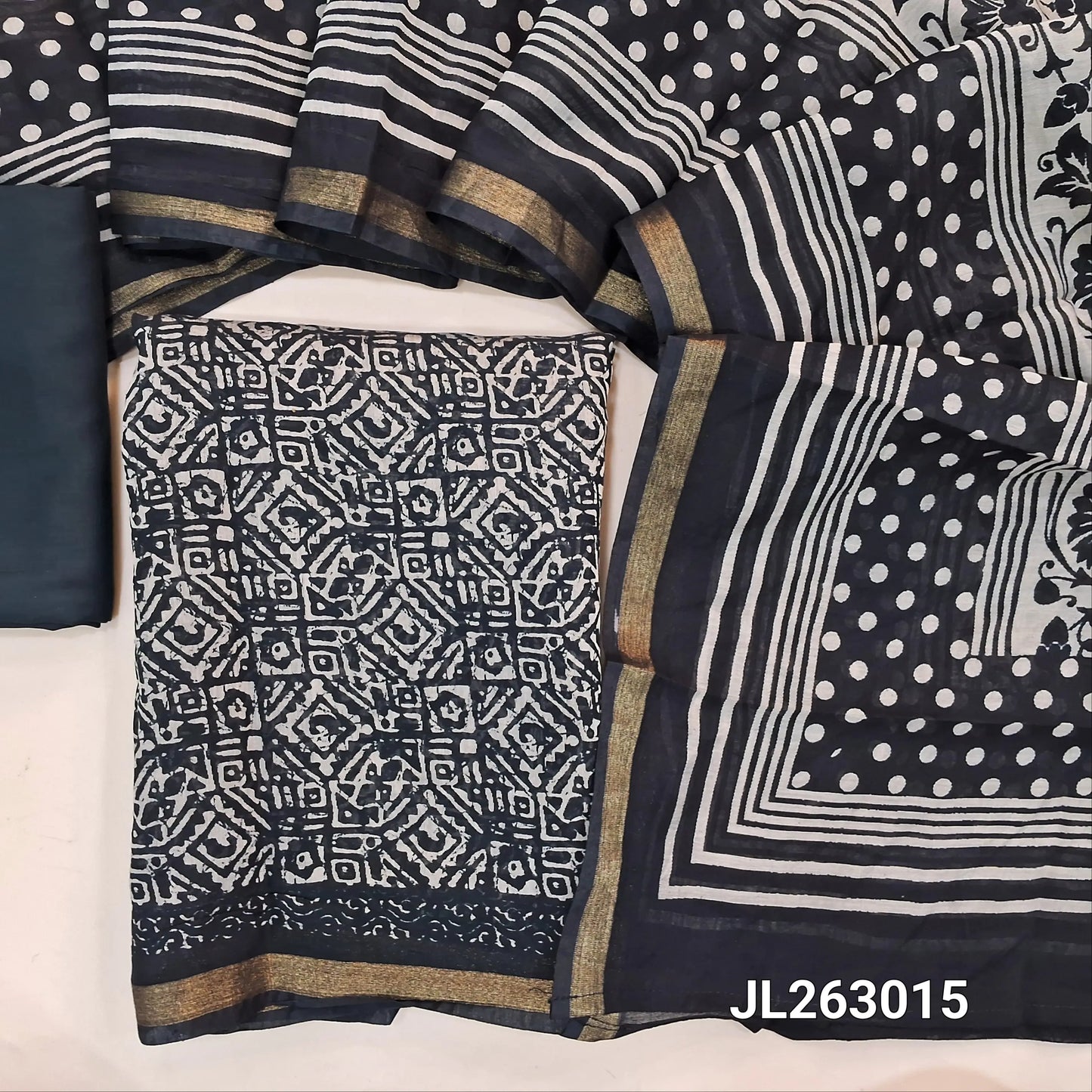 Black silk cotton unstitched salwar material,batik design all over,zari borders,(lining needed)spun cotton bottom,printed full length soft silk cotton dupatta with tissue borders. JL263015