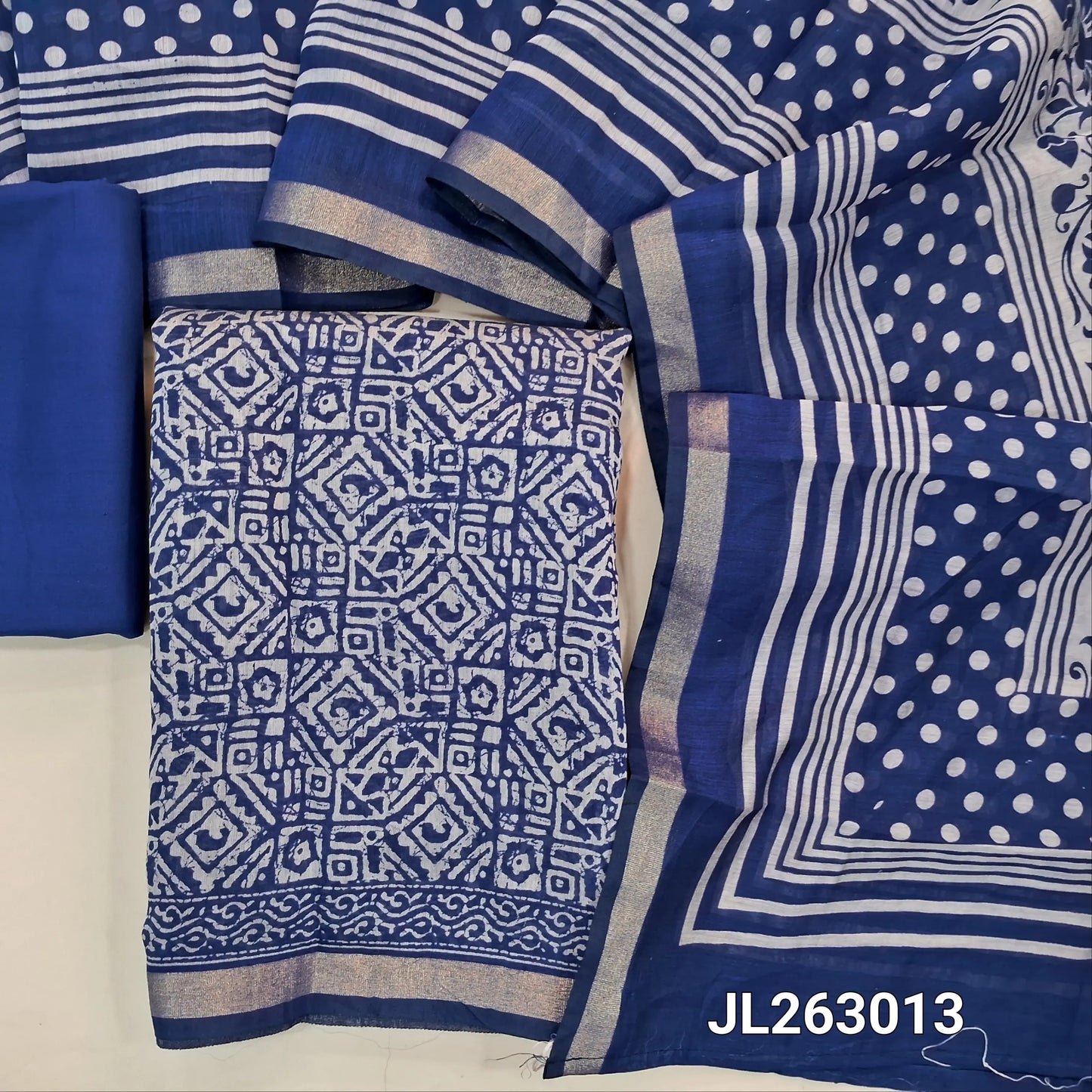 Dark blue silk cotton unstitched salwar material,batik design all over,zari borders,(lining needed)spun cotton bottom,printed full length soft silk cotton dupatta with tissue borders. JL263013