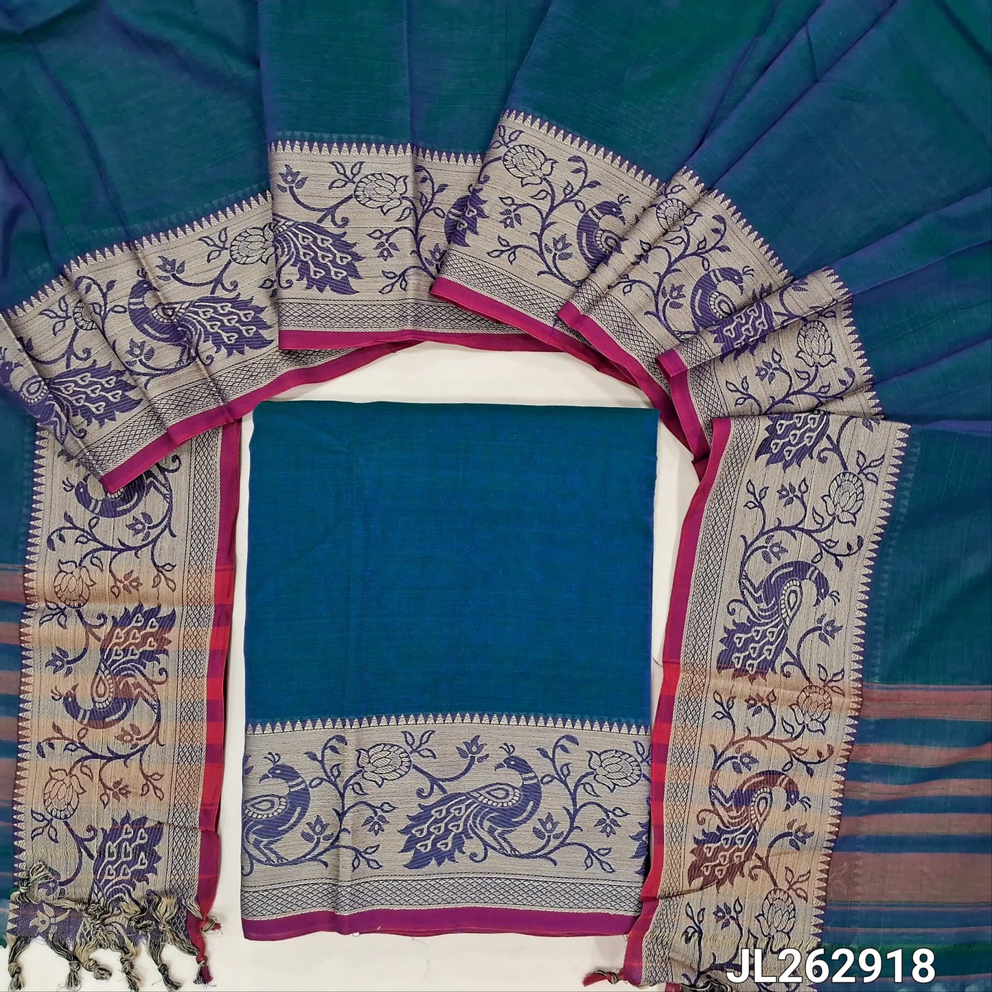 Peacock blue south mercerized handloom cotton unstitched salwar material(thin, lining needed) with contrast peacock thread woven border, bottom included with top, mercerized handloom cotton dupatta with thread woven borders & tassels. JL262918