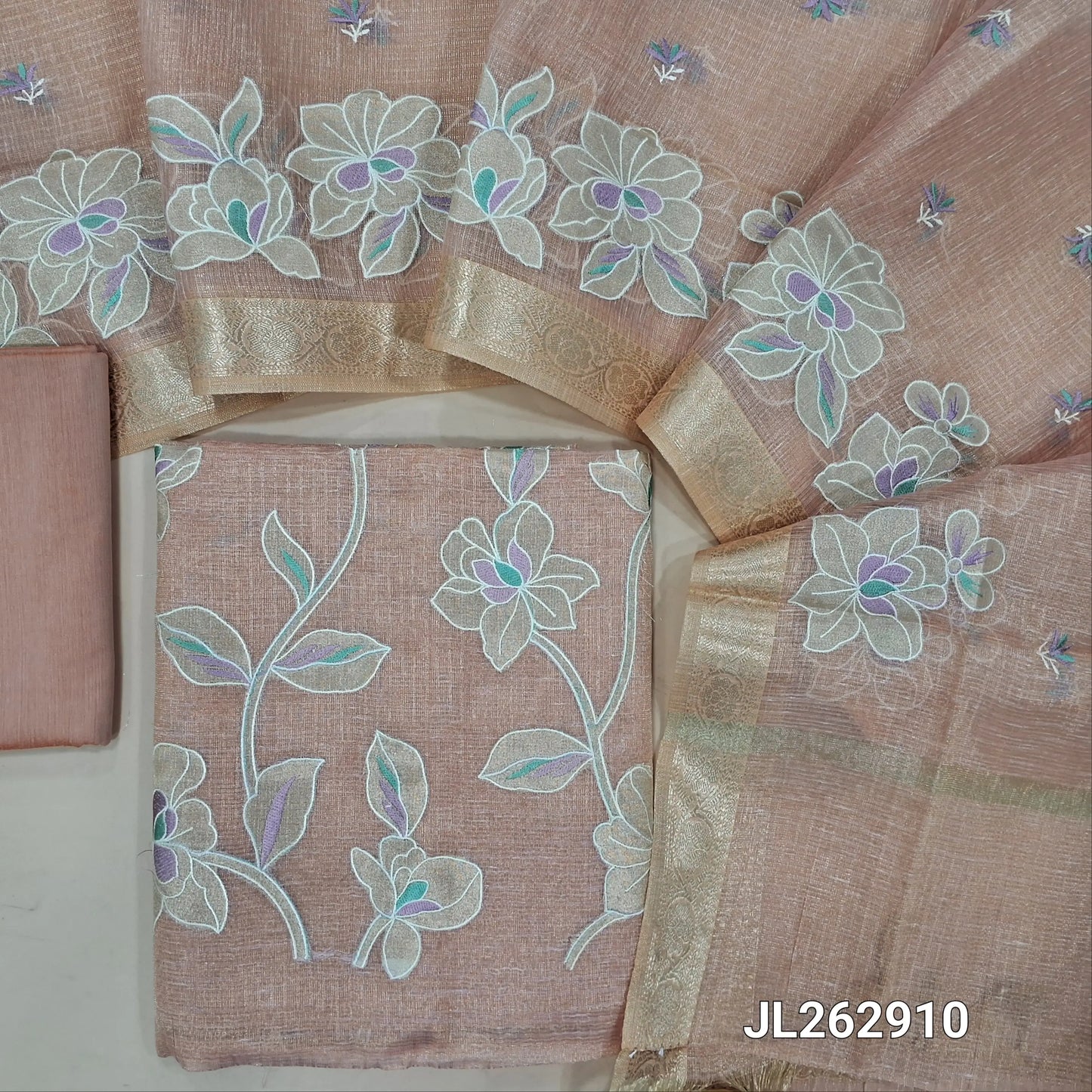 Pastel pink golden tint premium tissue kota unstitched salwar material, applique work and thread embroidery on front, (lining needed)cotton/silk cotton bottom,embroidery on tissue kota dupatta with applique work and zari borders. JL262910