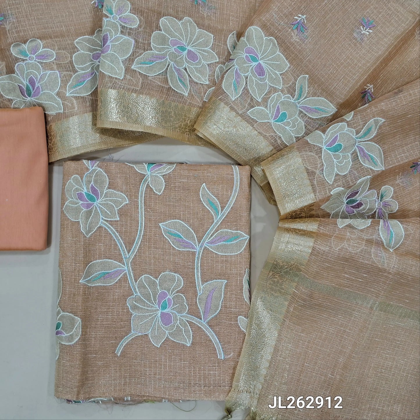 Pastel peach golden tint premium tissue kota unstitched salwar material, applique work and thread embroidery on front, (lining needed)cotton/silk cotton bottom,embroidery on tissue kota dupatta with applique work and zari borders. JL262912