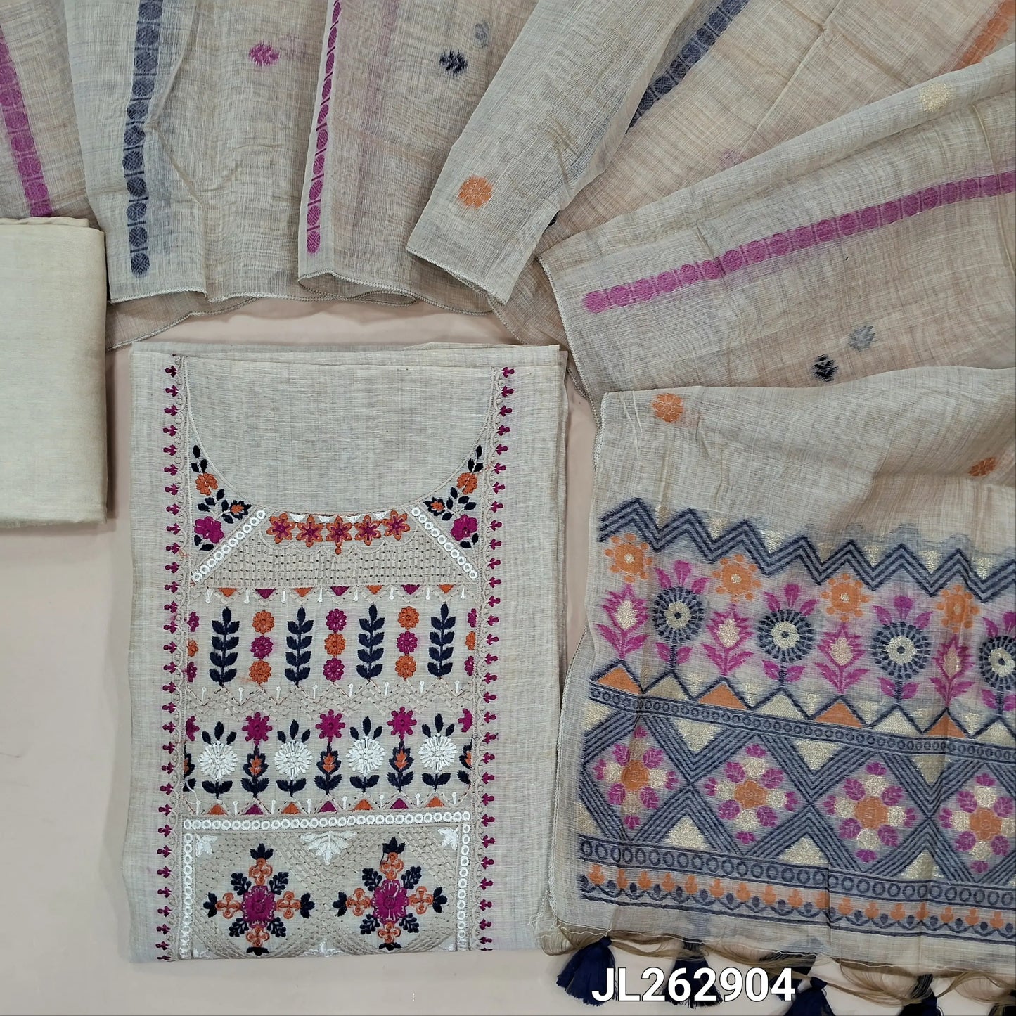 Designer beige base silk cotton unstitched salwar material, thread embroidery on yoke,(ORANGE/BLUE) (lining needed) santoon bottom, jamdani woven silk cotton dupatta with pallu and handmade tassles. JL262904