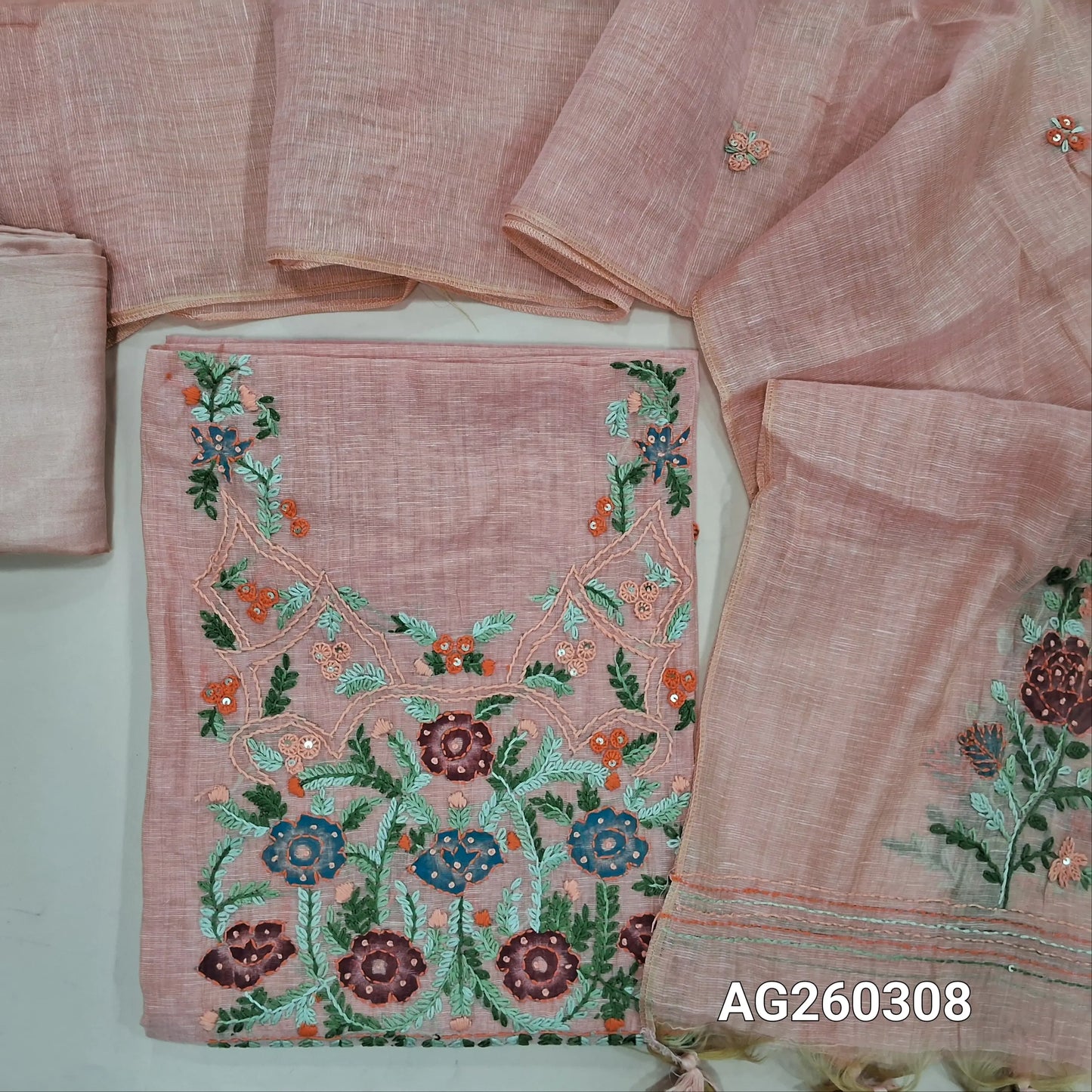 Pastel peach premium muga silk cotton unstitched salwar material,  rich hand embroidery work on yoke,embroidery on front,(lining needed)santoon bottom, hand embroidery work on muga silk cotton dupatta. AG260308