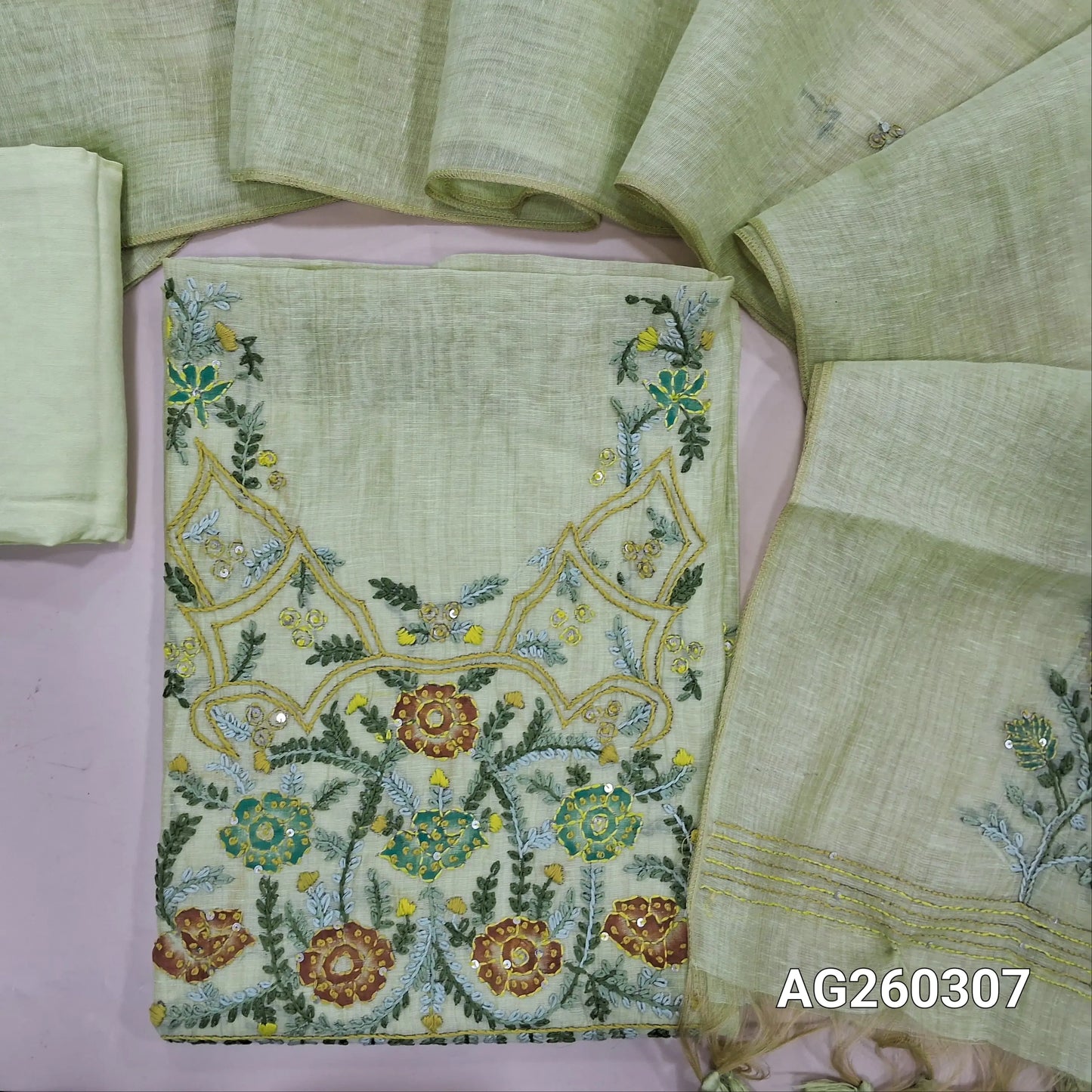 Pastel green premium muga silk cotton unstitched salwar material,  rich hand embroidery work on yoke,embroidery on front,(lining needed)santoon bottom, hand embroidery work on muga silk cotton dupatta. AG260307