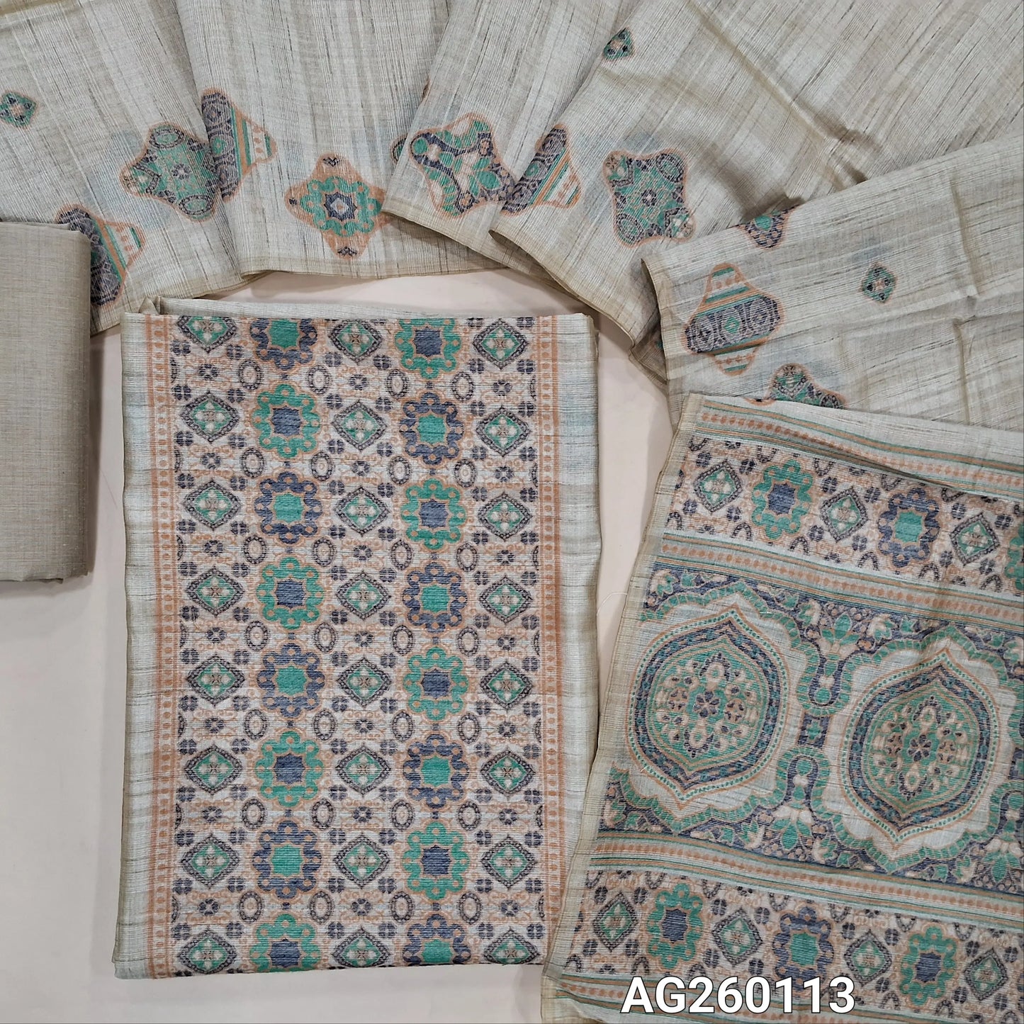Rich beige jamdani woven premium tussar unstitched salwar material,thread woven buttas all overTURQUOISE GREEN,(lining needed)silk cotton bottom, jamdani woven full length tussar dupatta wIth hand made tassles and borders. AG260113