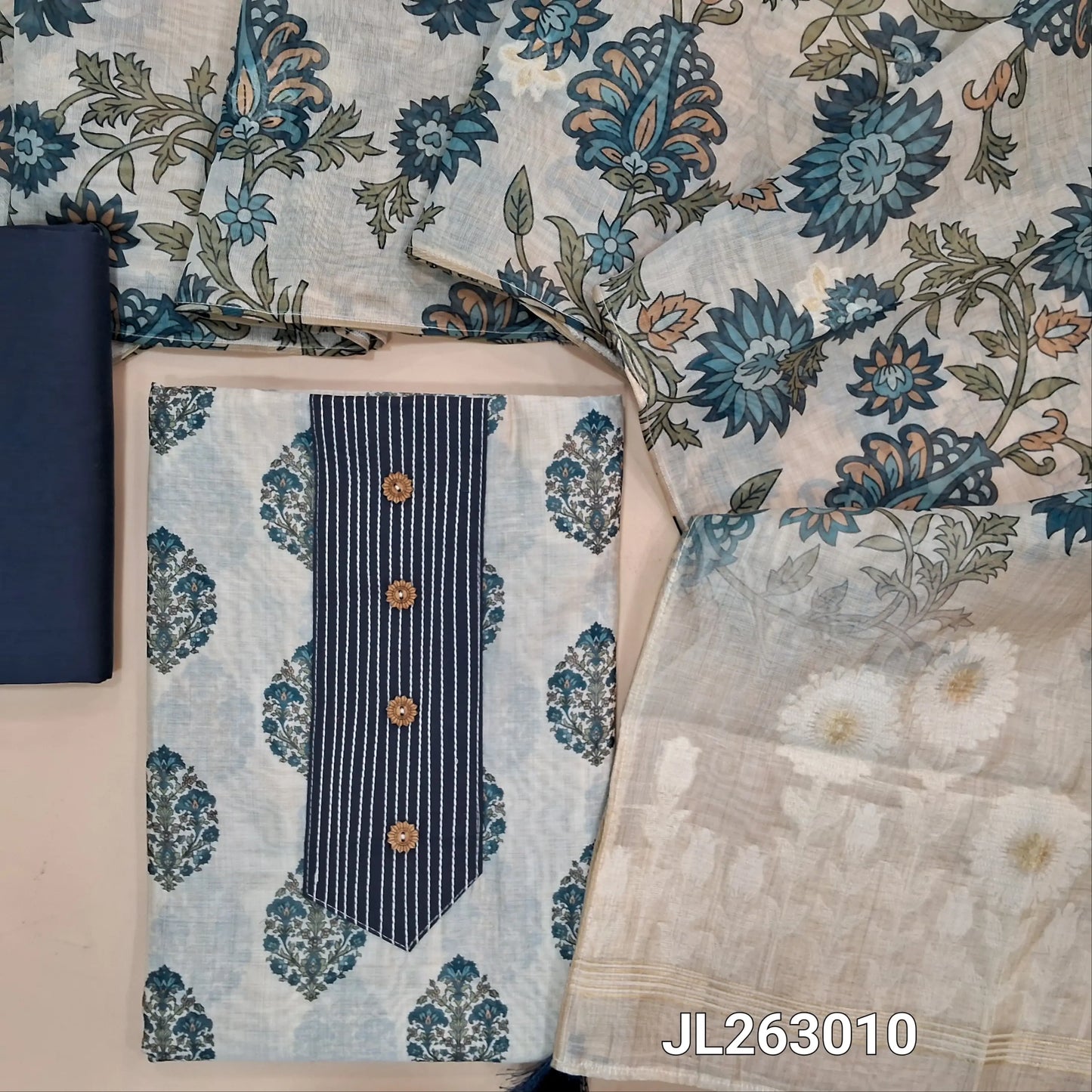 Off white base printed chanderi silk cotton unstitched salwar material,stitch work and buttons on yoke,(lining needed)blue silk cotton bottom, digital printed silk cotton dupatta with jamdani weaving pallu. JL263010