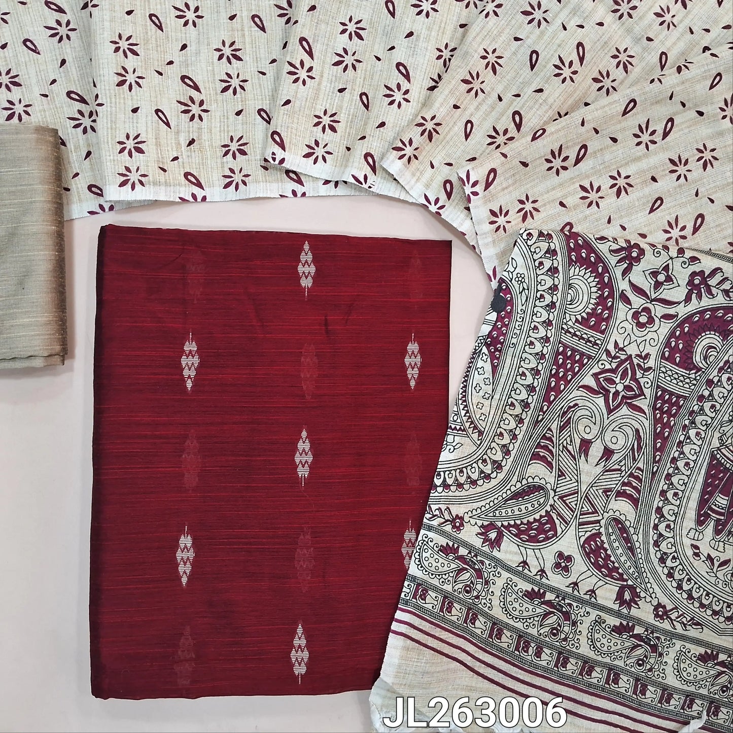 Reddish maroon slub silk cotton unstitched salwar material, thread woven buttas all over,(textured,lining needed)beige silk cotton bottom, madhubani printed jute cotton dupatta. JL263006