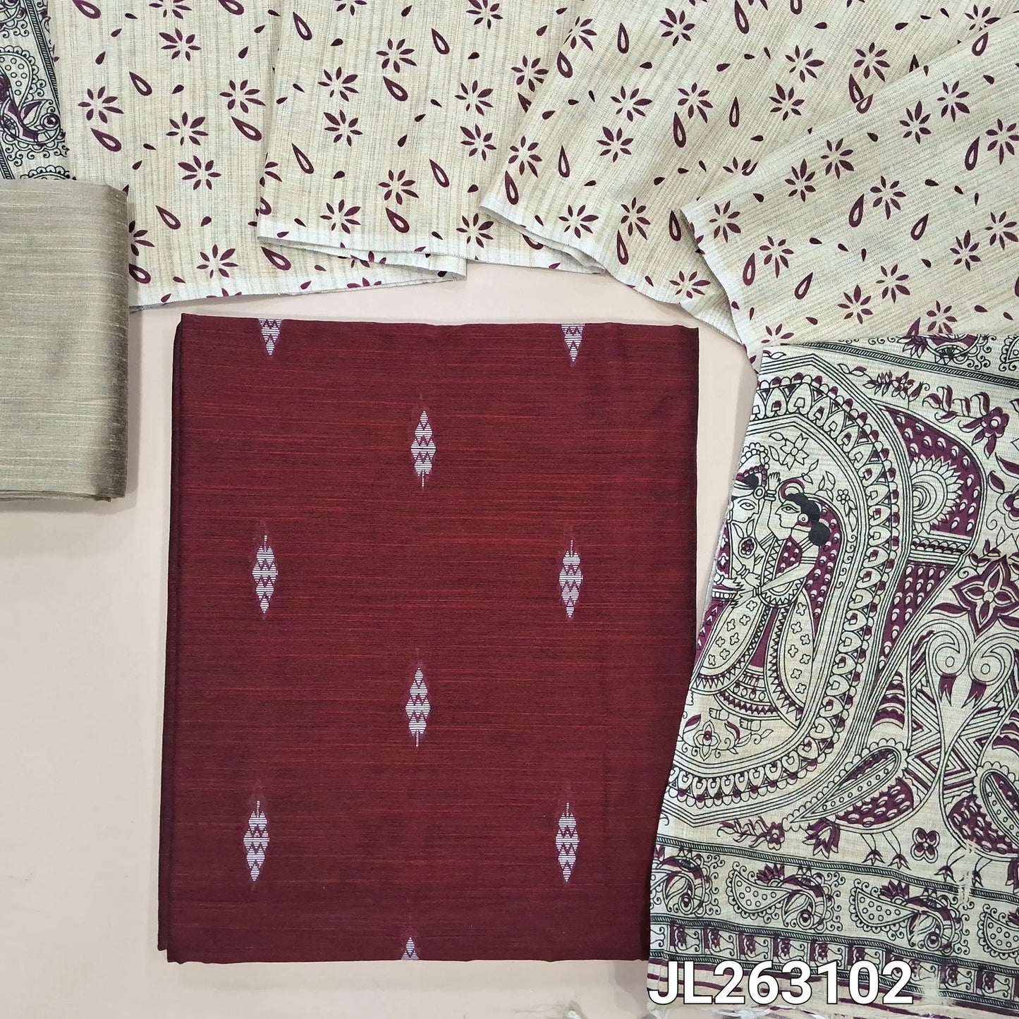 Dark maroon slub silk cotton unstitched salwar material, thread woven buttas all over,(textured,lining needed)beige silk cotton bottom, madhubani printed jute cotton dupatta. JL263102
