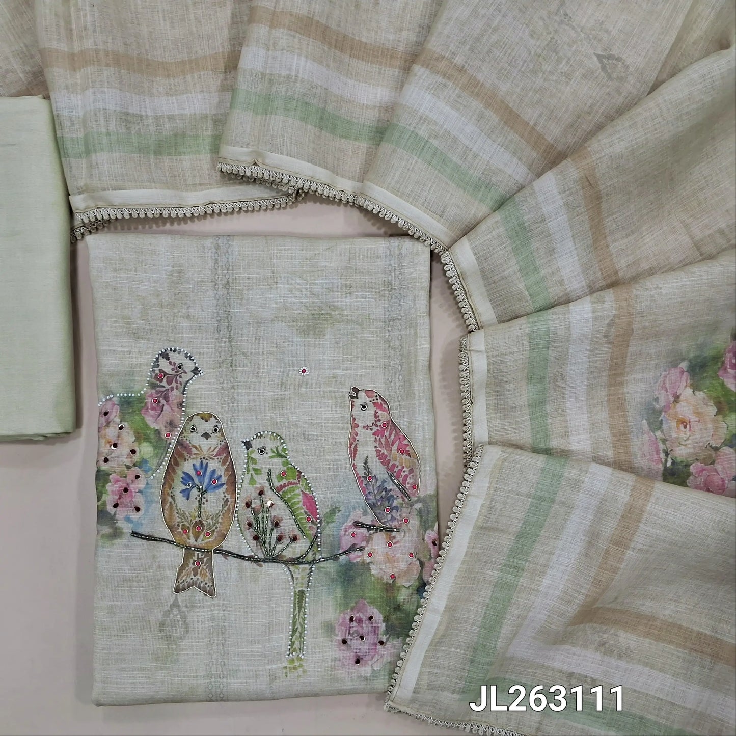 Rich beige semi linen unstitched salwar material, bird printed with sugar bead and cut bead work on yoke, floral and bead work on daman,(lining needed)spun cotton bottom, digital printed semi linen dupatta with lace tapping. JL263111