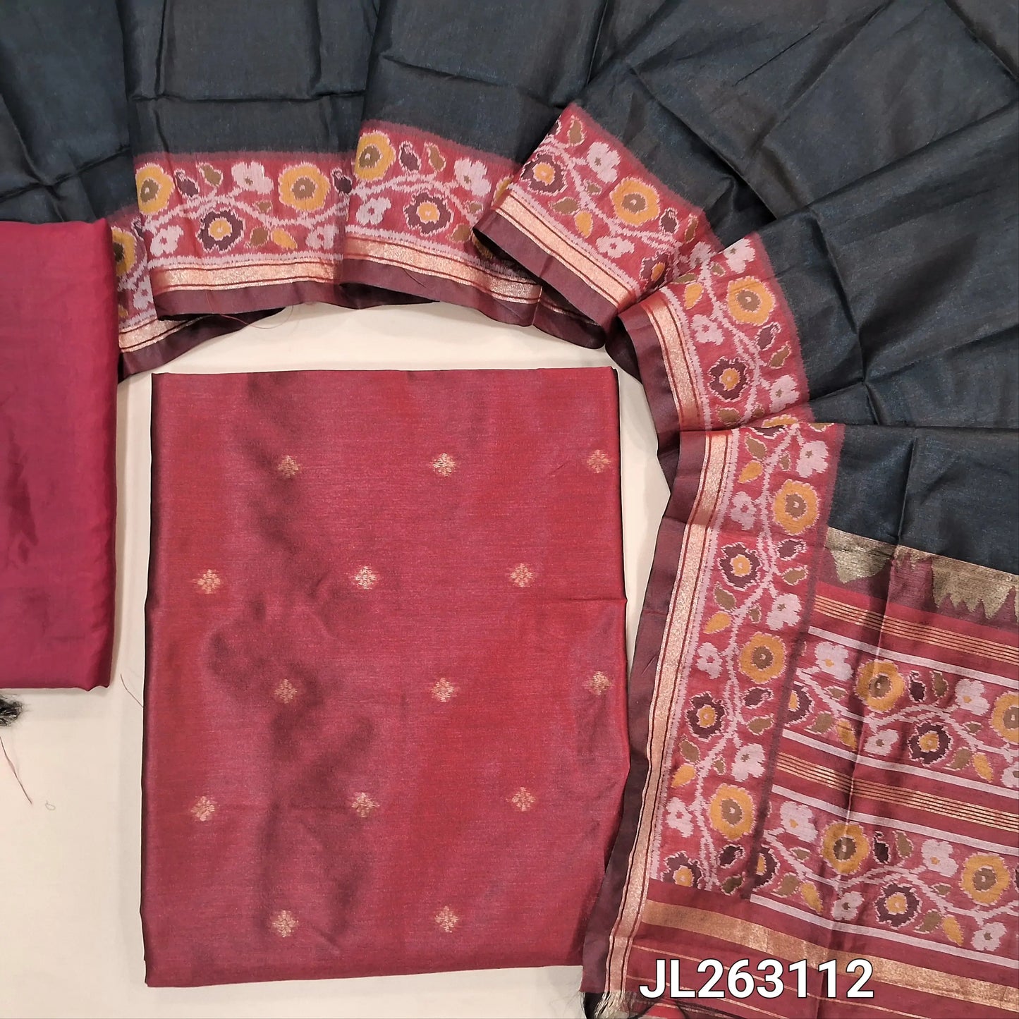 Dark maroon premium silk unstitched salwar material (light weight,lining needed)zari buttas front,gold tissue border on daman,matching santoon bottom,dual shade thread weaving on silk dupatta with rich pallu & tassles.JL263112