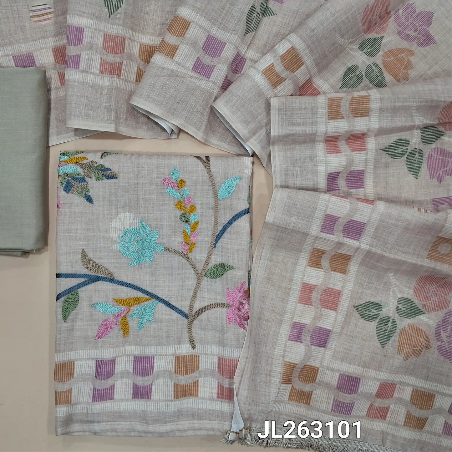 Rich beige semi linen unstitched salwar material,thread embroidery work on yoke,printed and thread embroidery work all over(lining needed)spun cotton bottom,digital printed semi linen dupatta with tasselled tapping. JL263101