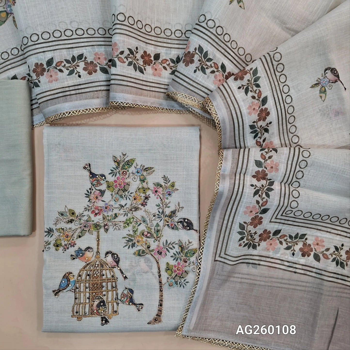 Light grey semi linen unstitched salwar material,printed all over,colorful digital printed with zarodzi and sequins on yoke,(lining needed)drum dyed cotton bottom,digital printed semi linen dupatta with lace tapping. AG260108