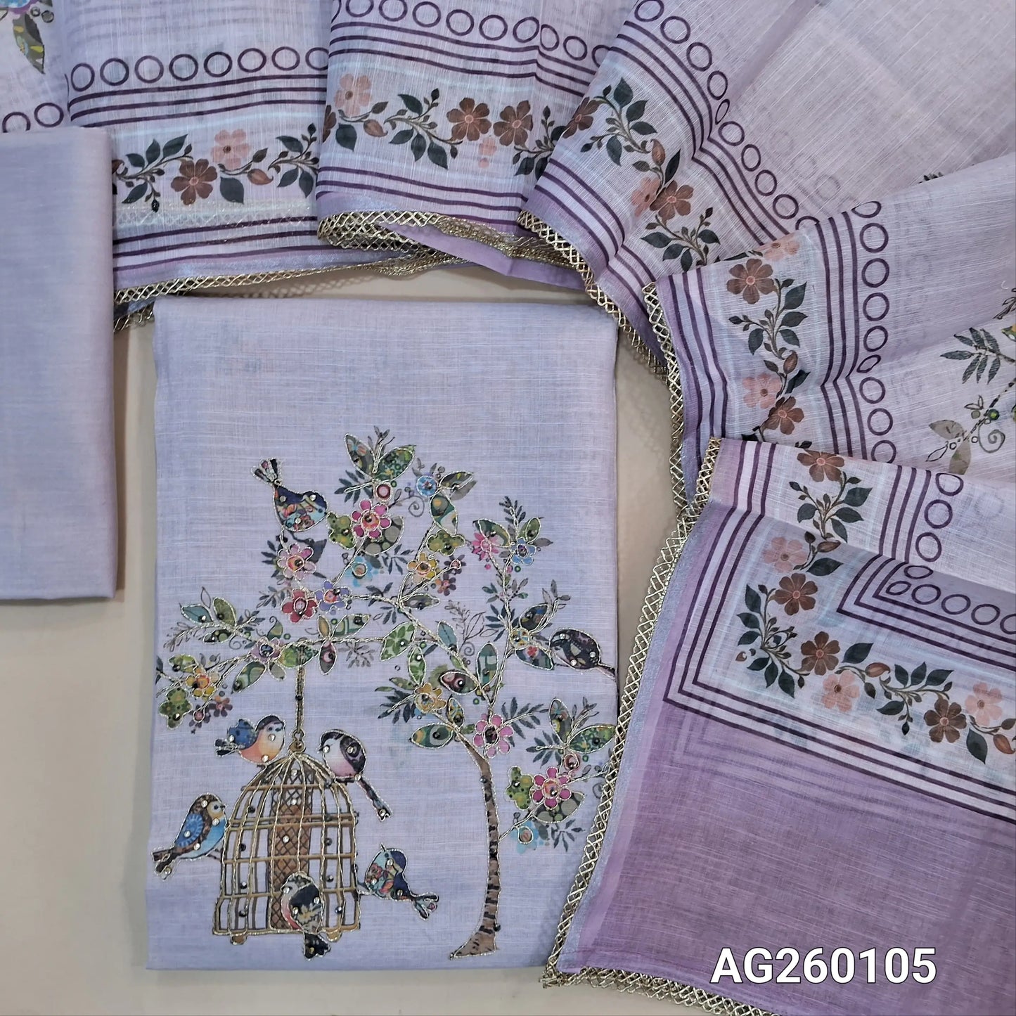 Light lavender semi linen unstitched salwar material,printed all over,colorful digital printed with zarodzi and sequins on yoke,(lining needed)drum dyed cotton bottom,digital printed semi linen dupatta with lace tapping. AG260105