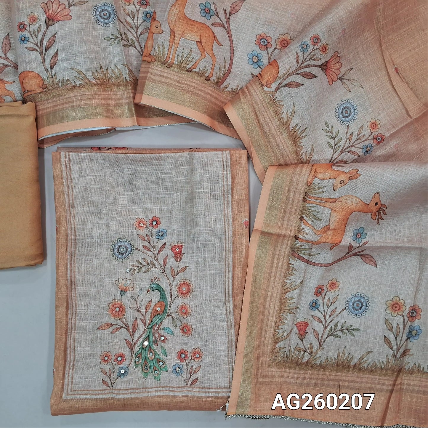 Peach tissue silk cotton unstitched salwar material,printed yoke with zari work,digital printed daman,(Lining needed)santoon bottom,digital printed tissue silk cotton dupatta. AG260207