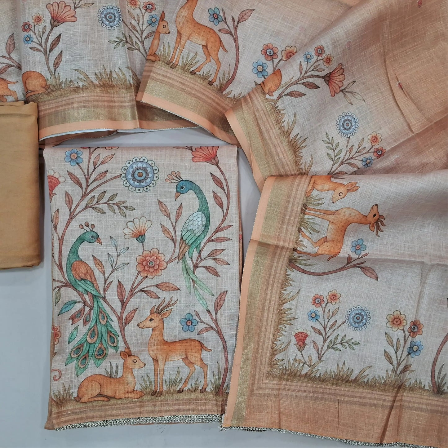 Peach tissue silk cotton unstitched salwar material,printed yoke with zari work,digital printed daman,(Lining needed)santoon bottom,digital printed tissue silk cotton dupatta. AG260207