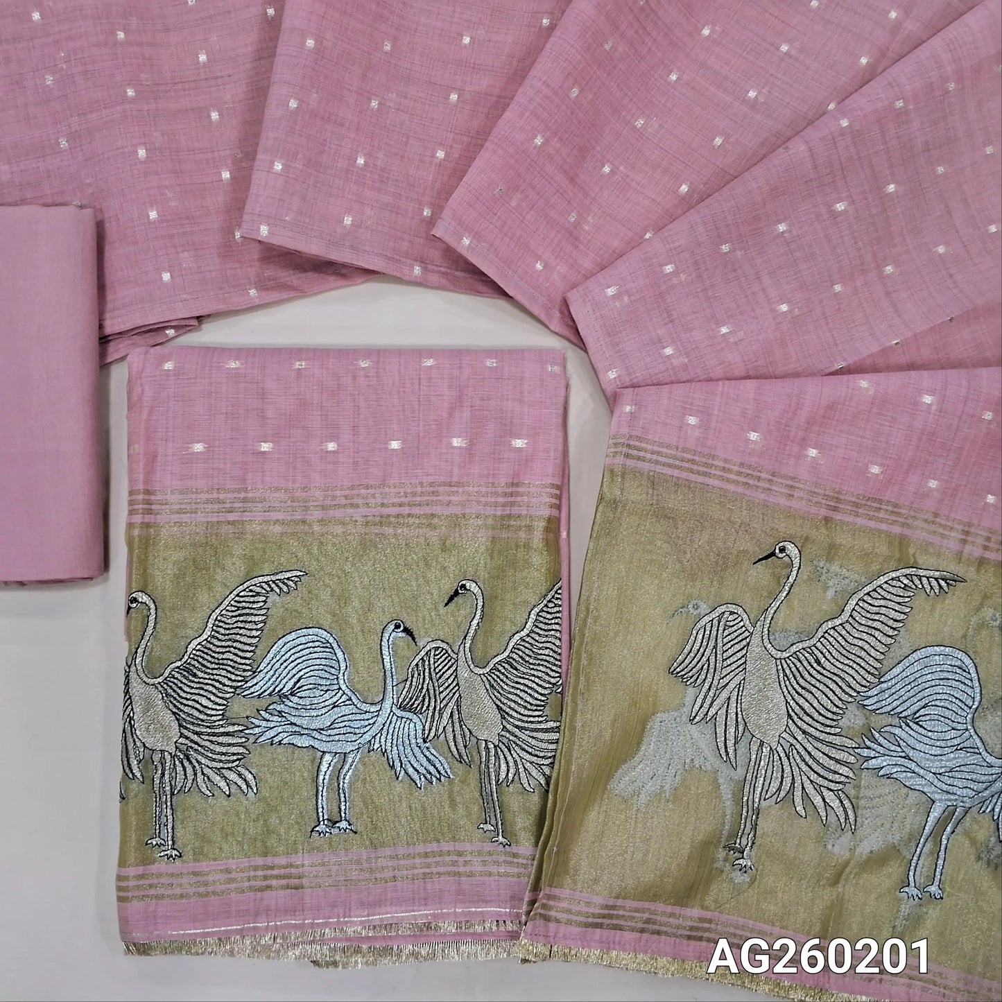 Pastel pink premium silk cotton unstitched salwar material,buttas all over,silver& anti gold zari embroidery,tissue daman(lining needed)matching santoon bottom, soft silk cotton dupatta with silver gold tissue with zari work pallu. AG260201