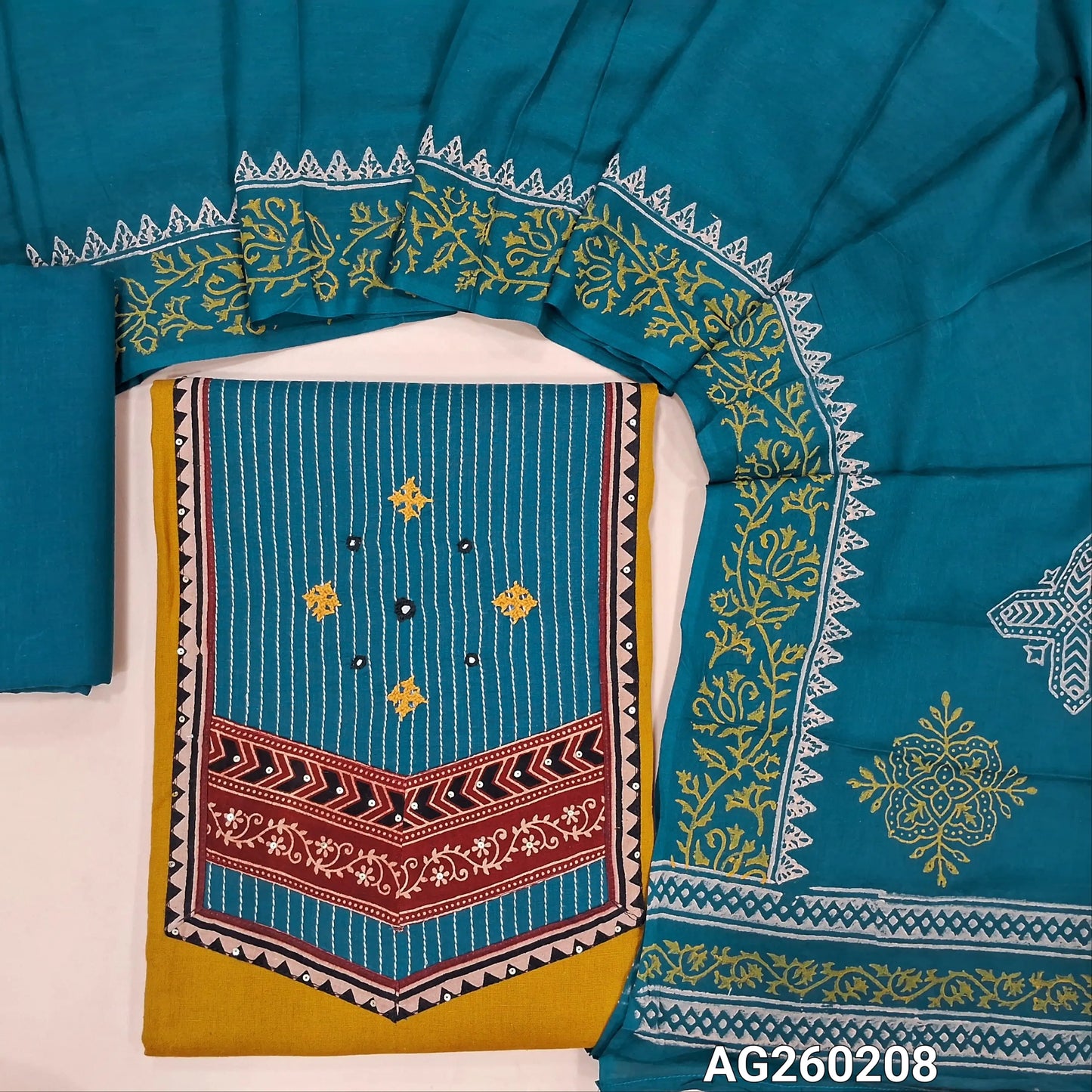 Mehandhi yellow premium dabu cotton unstitched salwar material,contrast ajrak yoke patch with hand embroidery and kantha stitch(soft,lining optional)teal blue cotton bottom, block printed mul cotton dupatta. AG260208