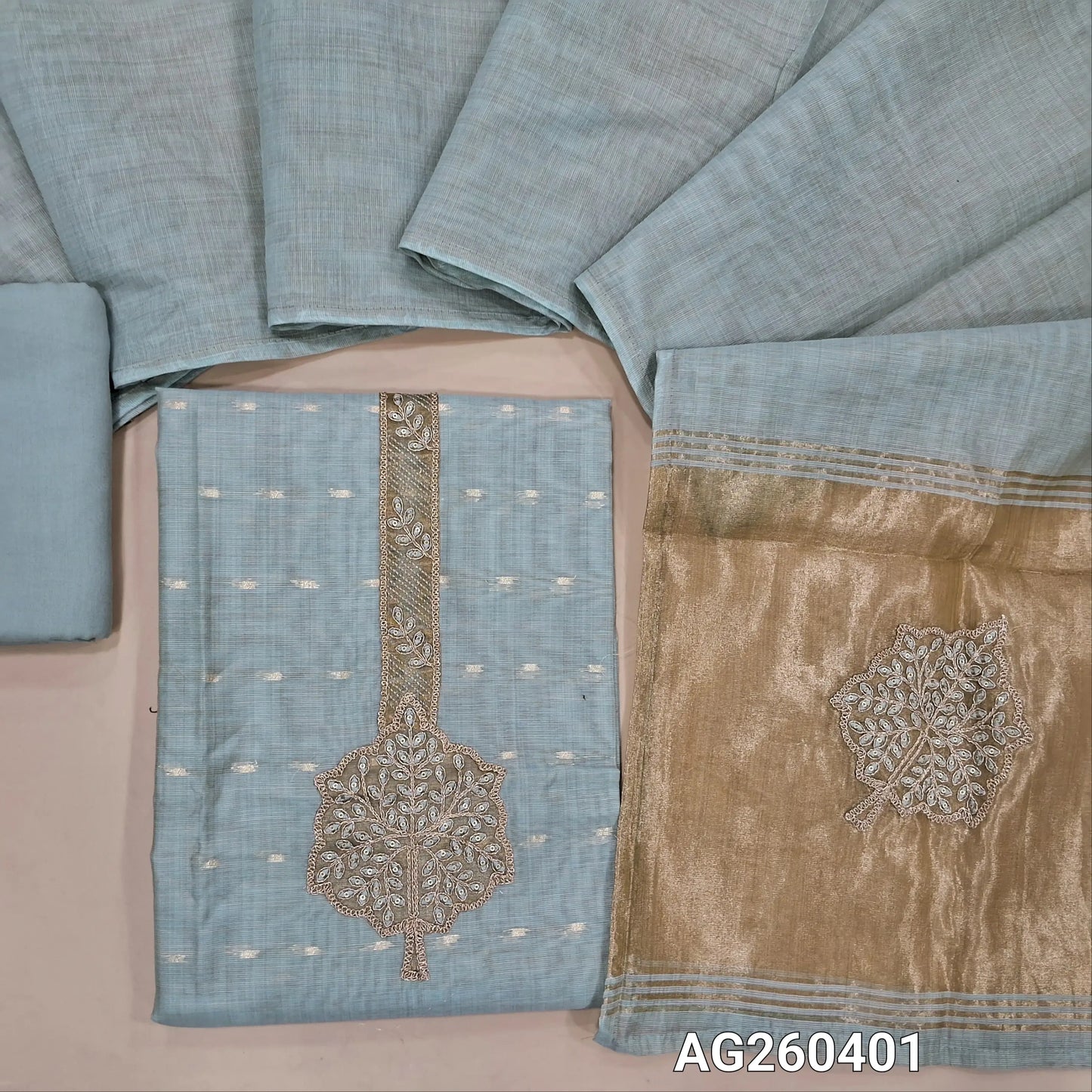 Sea green premium silk cotton unstitched salwar material,seqins and zari work on yoke, zari buttas all over,rich daman,(lining needed) spun cotton bottom, designer premium silk cotton dupatta with rich pallu. AG260402
