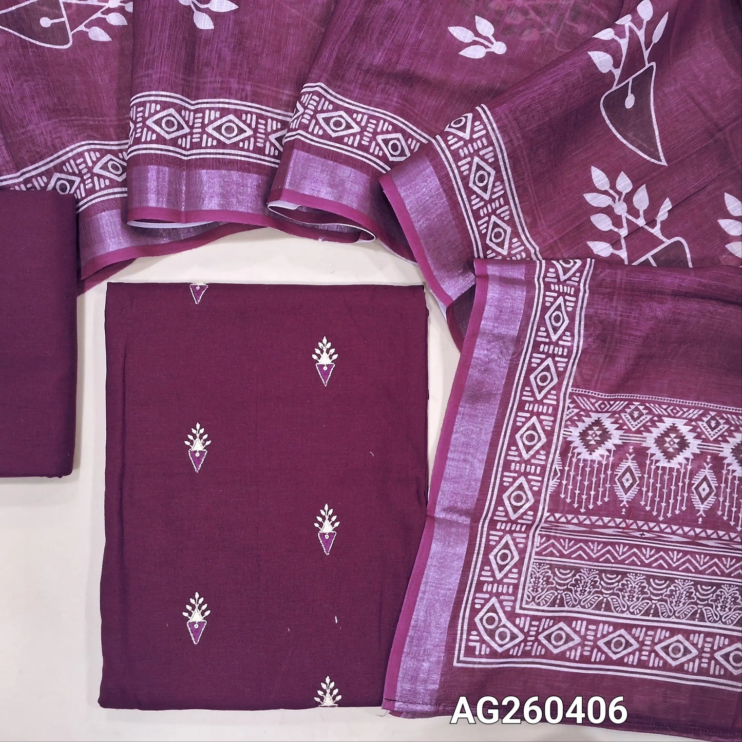 Dark purple pure cotton unstitched salwar material,embroidery on front,(lining optional) cotton bottom, printed on semi linen dupatta with silver tissue borders. AG260406
