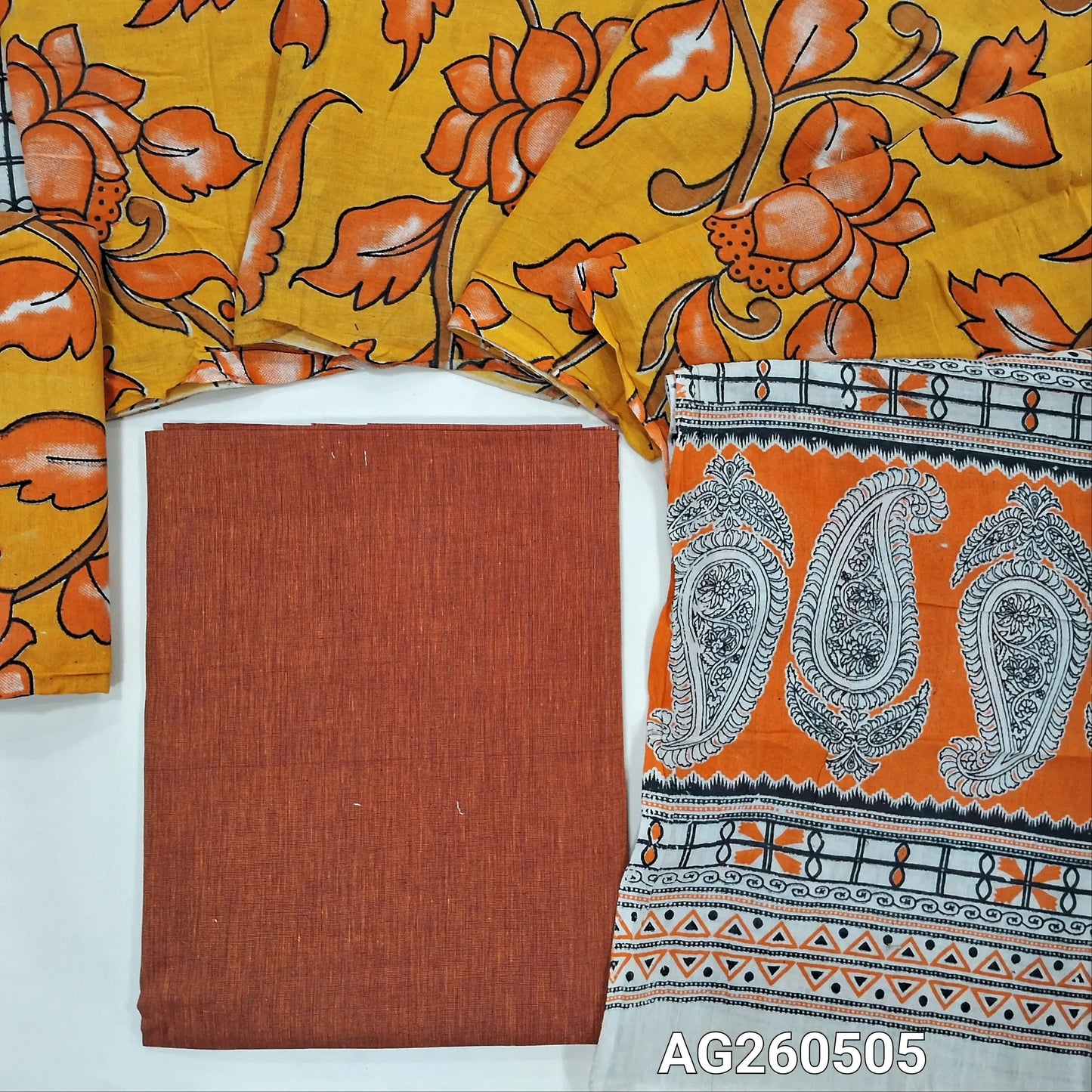 Rust orange handloom cotton unstitched salwar material,(lining optional)mehandhi yellow kalamkari hand block printed cotton bottom,kalamkari hand block printed mul cotton dupatta with contrast pallu. AG260505