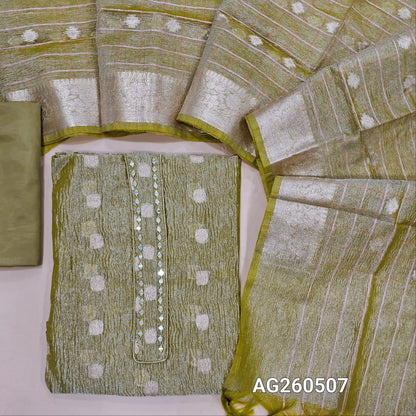 Pastel green with golden tint crinkled tissue silk cotton unstitched salwar material,mirror on yoke, buttas all over,(thin, lining needed)silky/silk cotton bottom, zari woven on crinkled tissue silk cotton dupatta with borders. AG260507