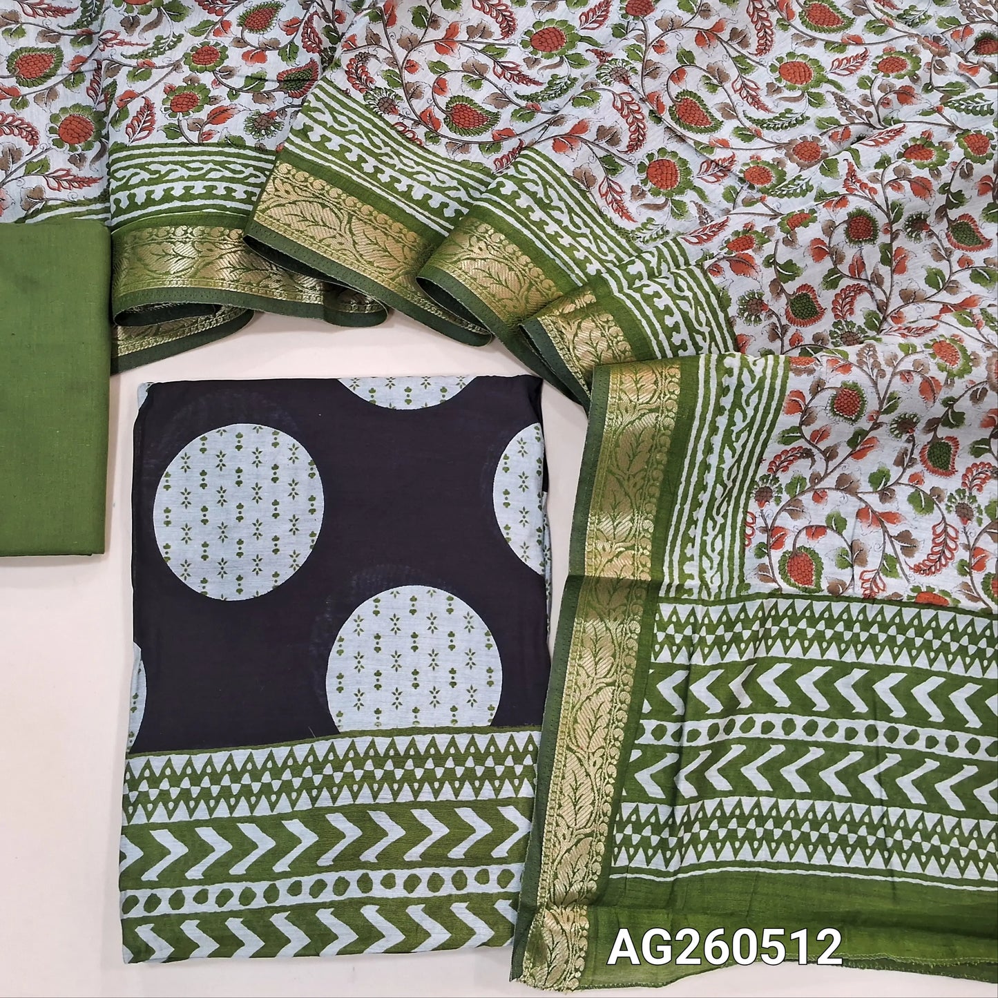 Black base soft silk cotton unstitched salwar material,polka design, printed all over,(lining needed)green cotton bottom,floral printed silk cotton dupatta with borders and pallu. AG260512