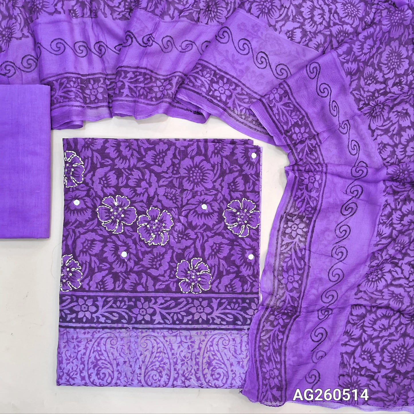 Dark purple & lavender hand block printed premium kota unstitched salwar material, mirror & floral printed with hand embroidery work on yoke,(Lining Needed)cotton bottom,dual shaded hand block printed chiffon dupatta. AG260514