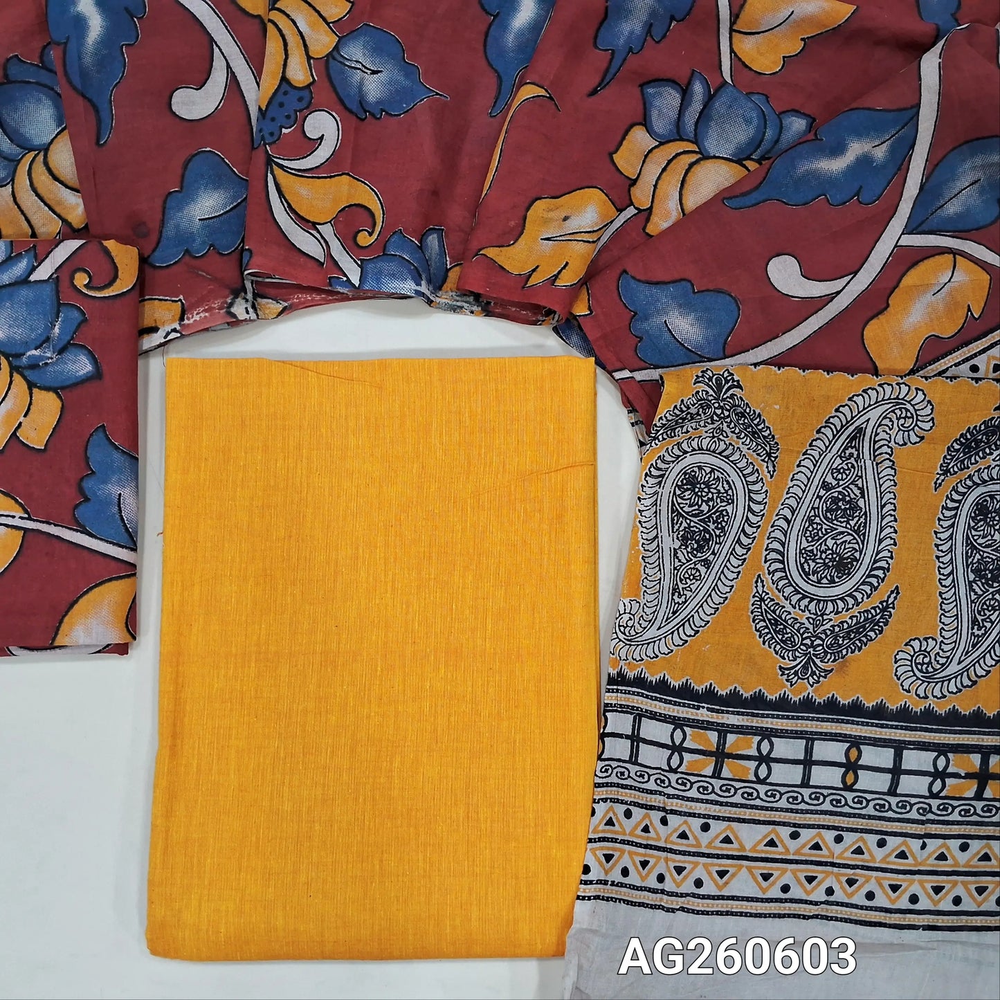 Mango yellow handloom cotton unstitched salwar material,(lining optional)reddish maroon kalamkari hand block printed cotton bottom,kalamkari hand block printed mul cotton dupatta with contrast pallu. AG260603