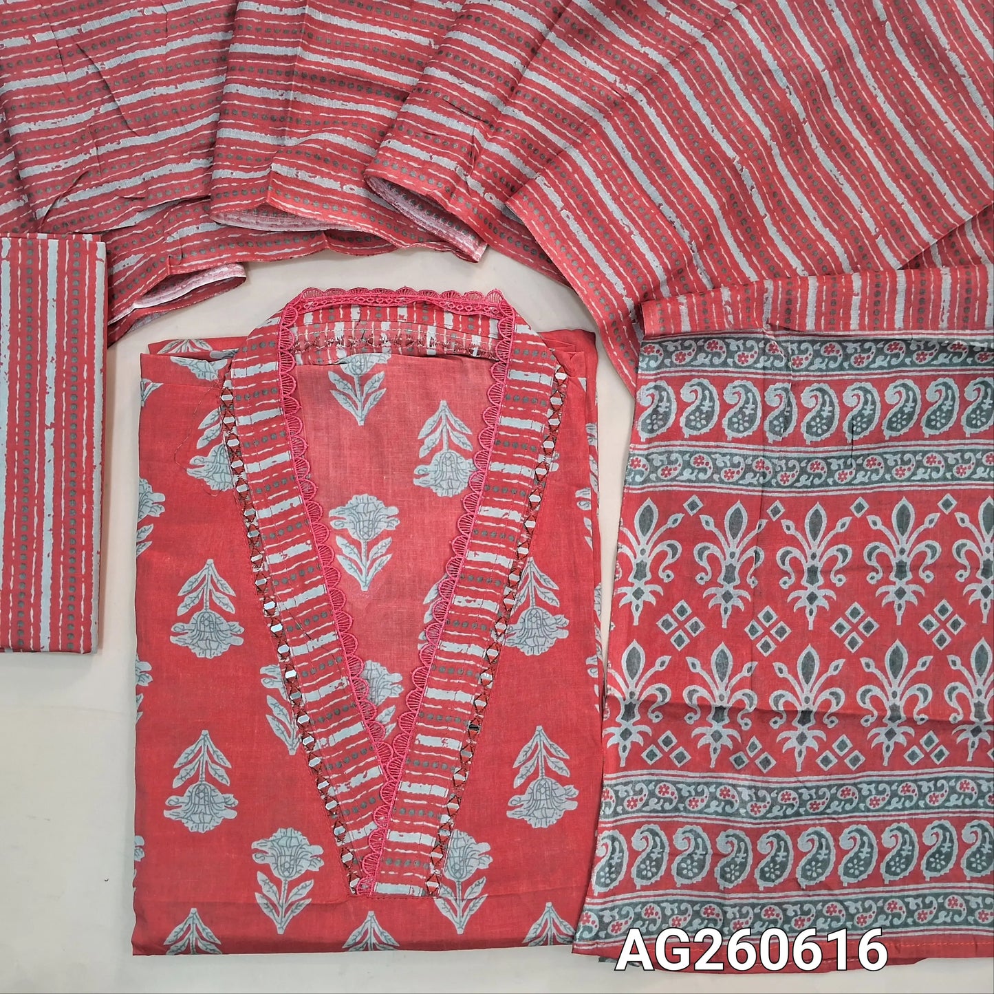 Bright peachish pink printed pure cotton unstitched salwar material,v collar neck with real mirror and lace work (lining optional)printed cotton bottom, printed full length mul cotton dupatta with pallu. AG260616