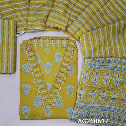 Mehandhi yellow printed pure cotton unstitched salwar material,v collar neck with real mirror and lace work (lining optional)printed cotton bottom, printed full length mul cotton dupatta with pallu. AG260617