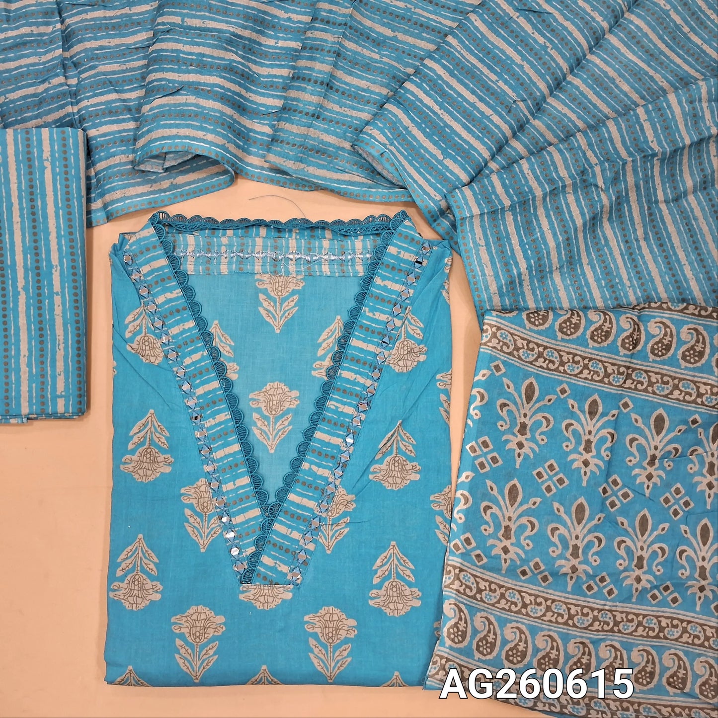 Blue printed pure cotton unstitched salwar material,v collar neck with real mirror and lace work (lining optional)printed cotton bottom, printed full length mul cotton dupatta with pallu. AG260615