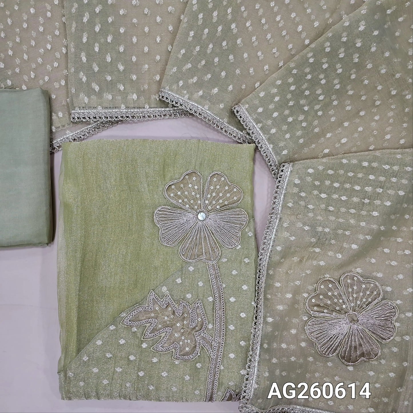 Pastel green with golden tint crinkled tissue organza unstitched salwar material,applique with zari and sequins on daman,(thin, lining needed)silky bottom,benarasi zari woven and applique work on tissue organza dupatta with lace tapping. AG260614