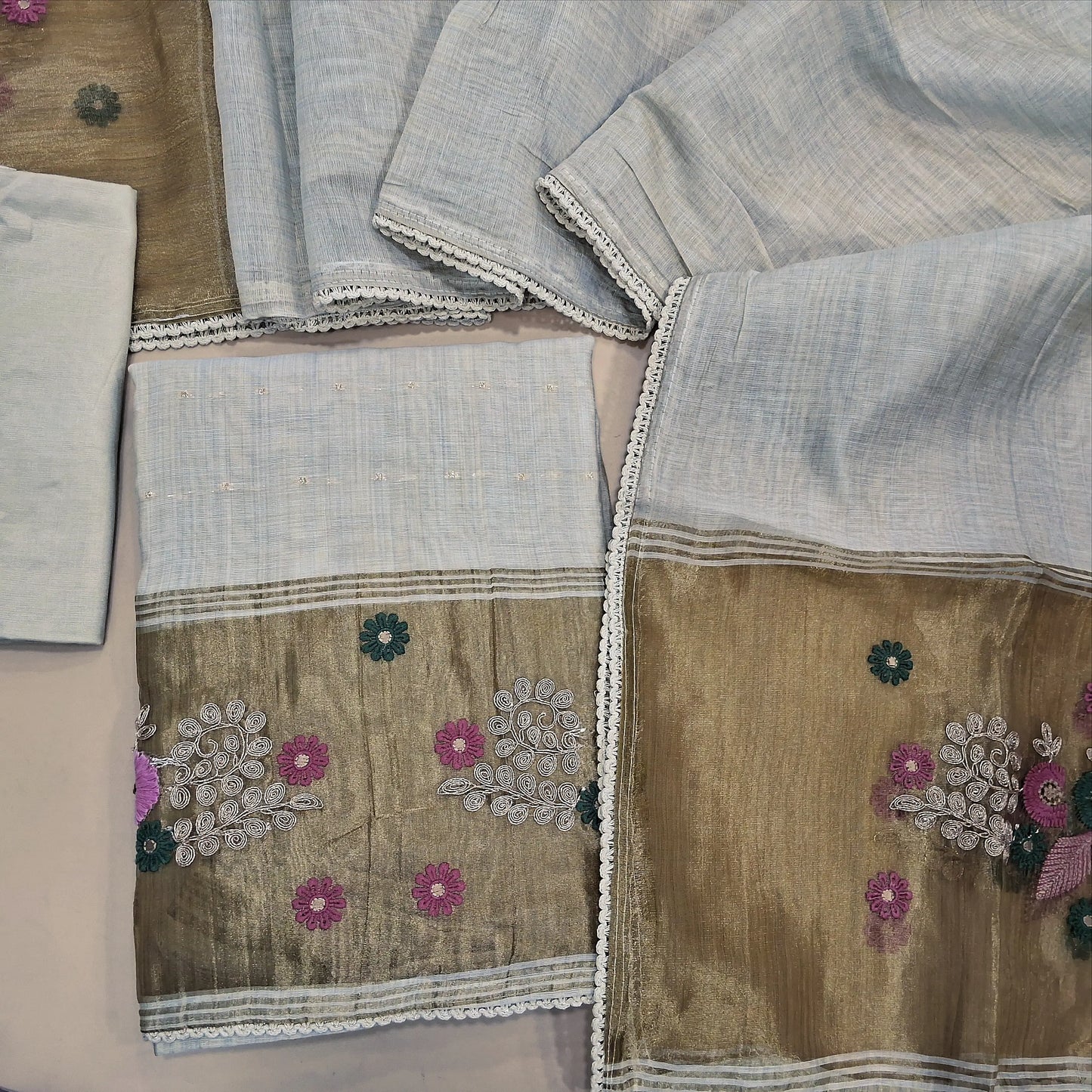 Rich beige premium silk cotton unstitched salwar material,embroidery & zari yoke,zari buttas,gold tissue and embroidery and zari work on daman,(lining needed)santoon bottom, silk cotton dupatta with embriodery work with tissue pallu. AG260701