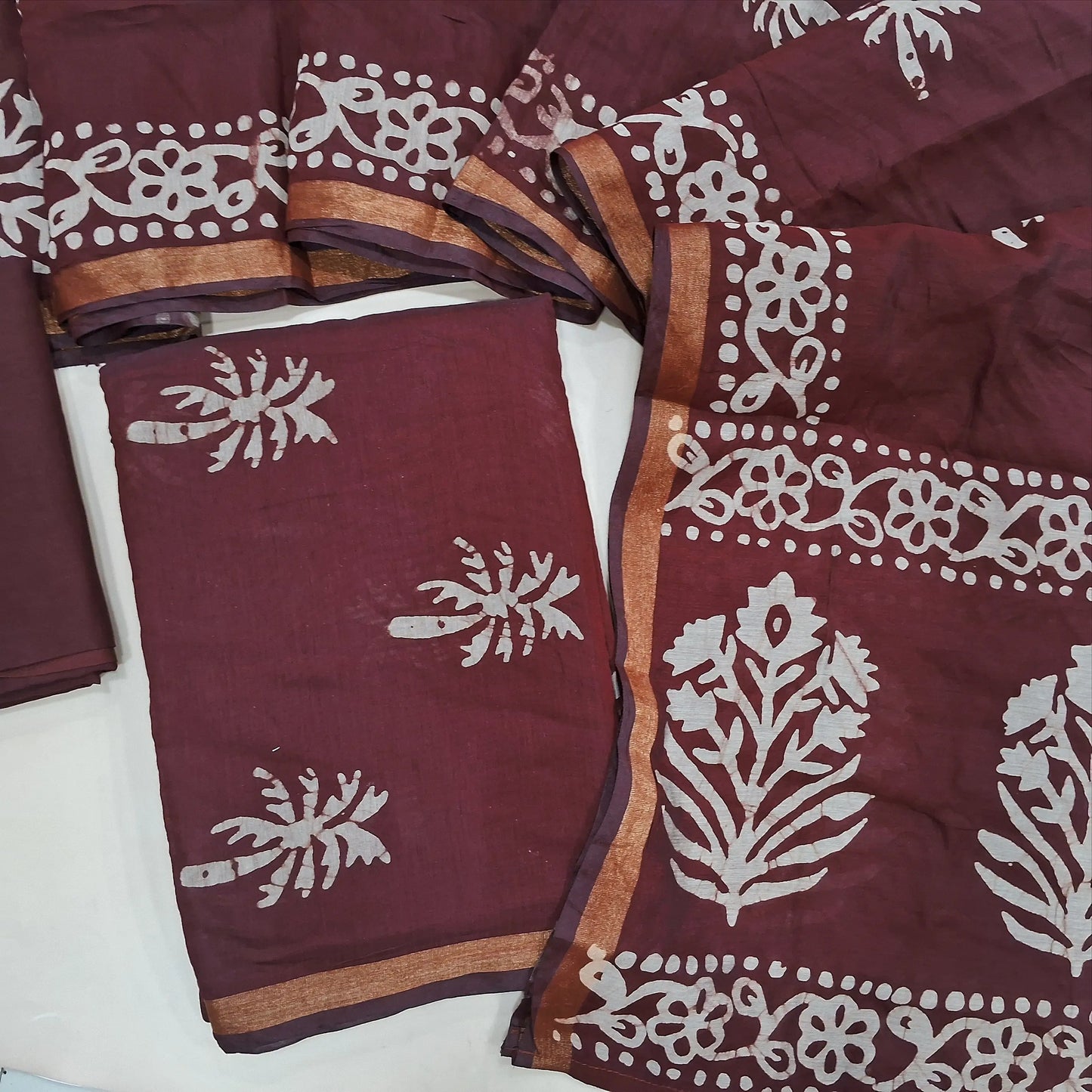 Dark maroon original wax batik silk cotton unstitched salwar material, gold tissue borders,(Lining Needed)cotton bottom, batik design on silk cotton dupatta with tissue borders(TAPPING NEEDED). AG260702