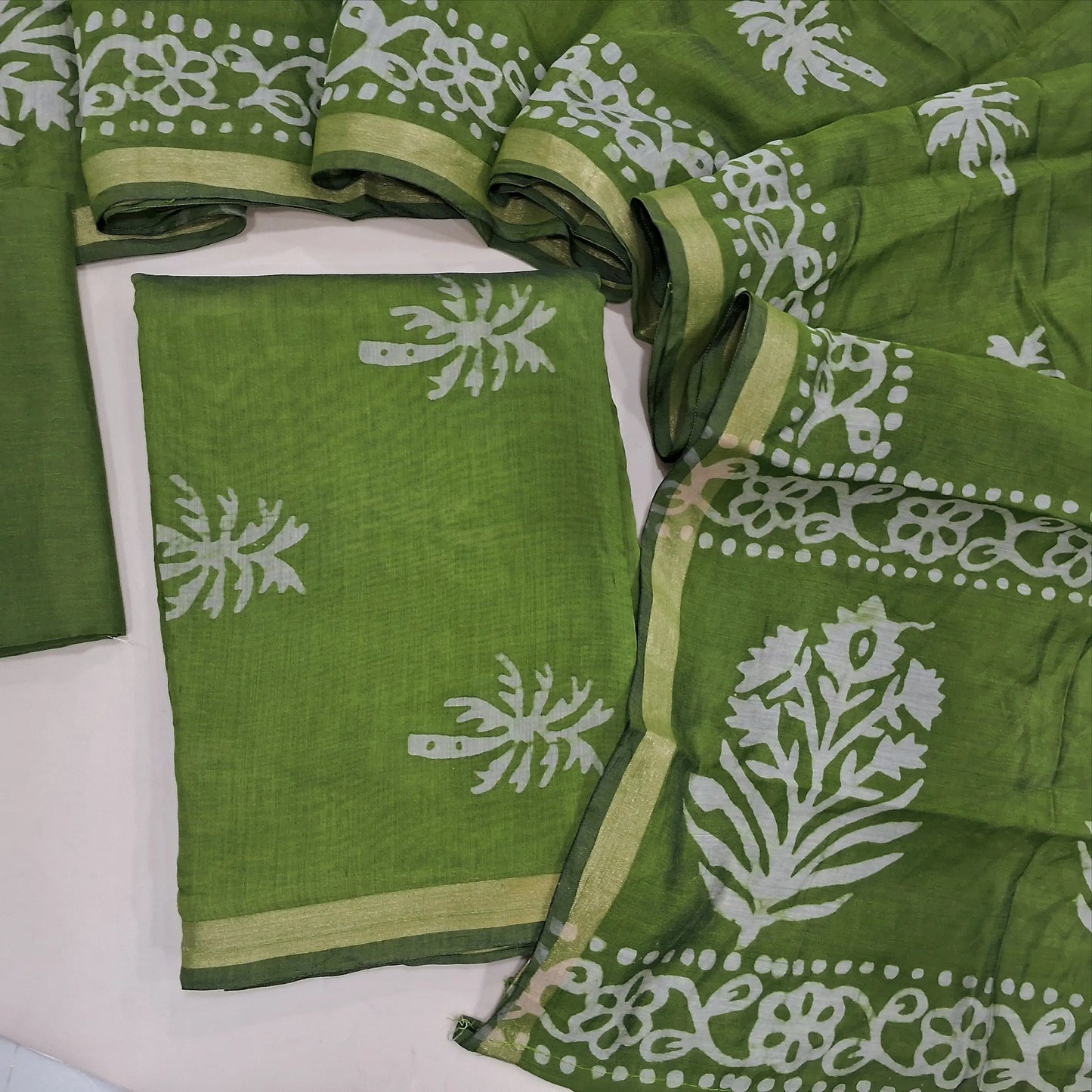 Leafy green original wax batik silk cotton unstitched salwar material, gold tissue borders,(Lining Needed)cotton bottom, batik design on silk cotton dupatta with tissue borders(TAPPING NEEDED). AG260703