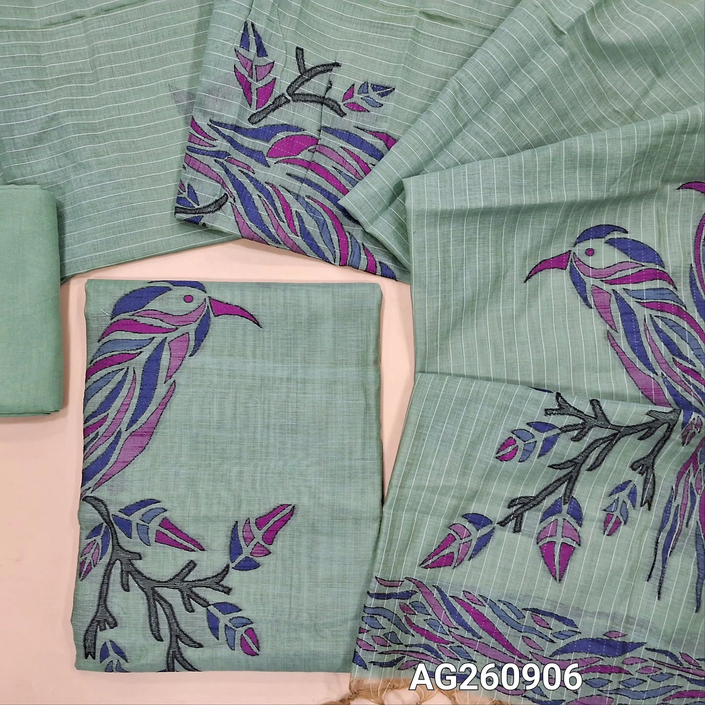 Sage green silk cotton unstitched salwar material,buttas all over, bird weaving on daman,(Lining Needed)santoon bottom,thread woven lines & weaving design on full length silk cotton dupatta with tassles . AG260906