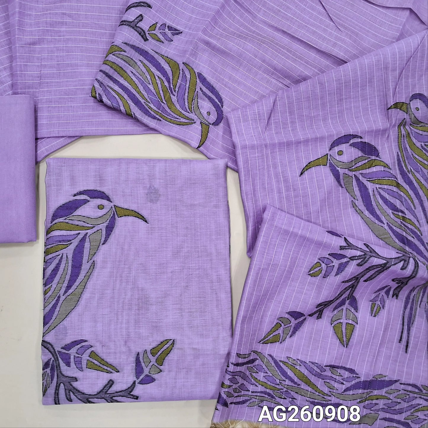Lavender silk cotton unstitched salwar material,buttas all over, bird weaving on daman,(Lining Needed)santoon bottom,thread woven lines & weaving design on full length silk cotton dupatta with tassles . AG260908