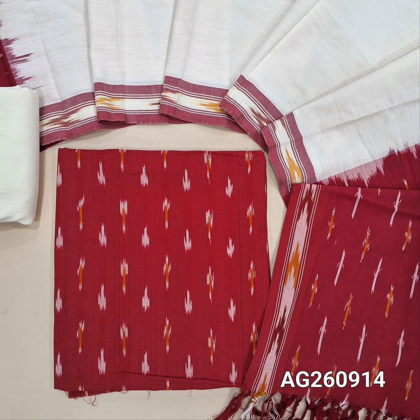 Red premium ikat woven handloom cotton unstitched salwar material, (lining optional)off white cotton bottom, dual shaded handloom cotton dupatta with borders and tassles. AG260914