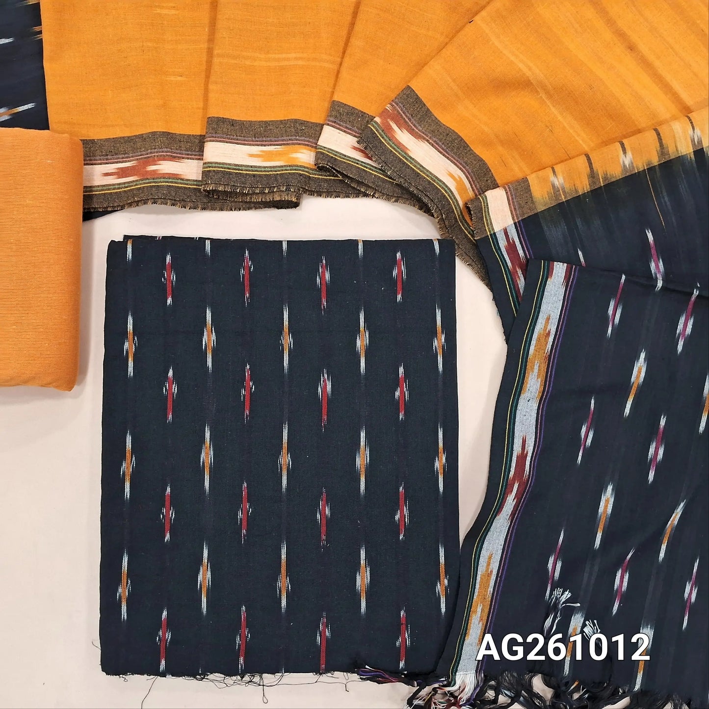 Black premium ikat woven handloom cotton unstitched salwar material, (lining optional)yellowcotton bottom, dual shaded handloom cotton dupatta with borders and tassles(INCONSISTENT WEAVING ARE NOT DEFECTS). AG261012