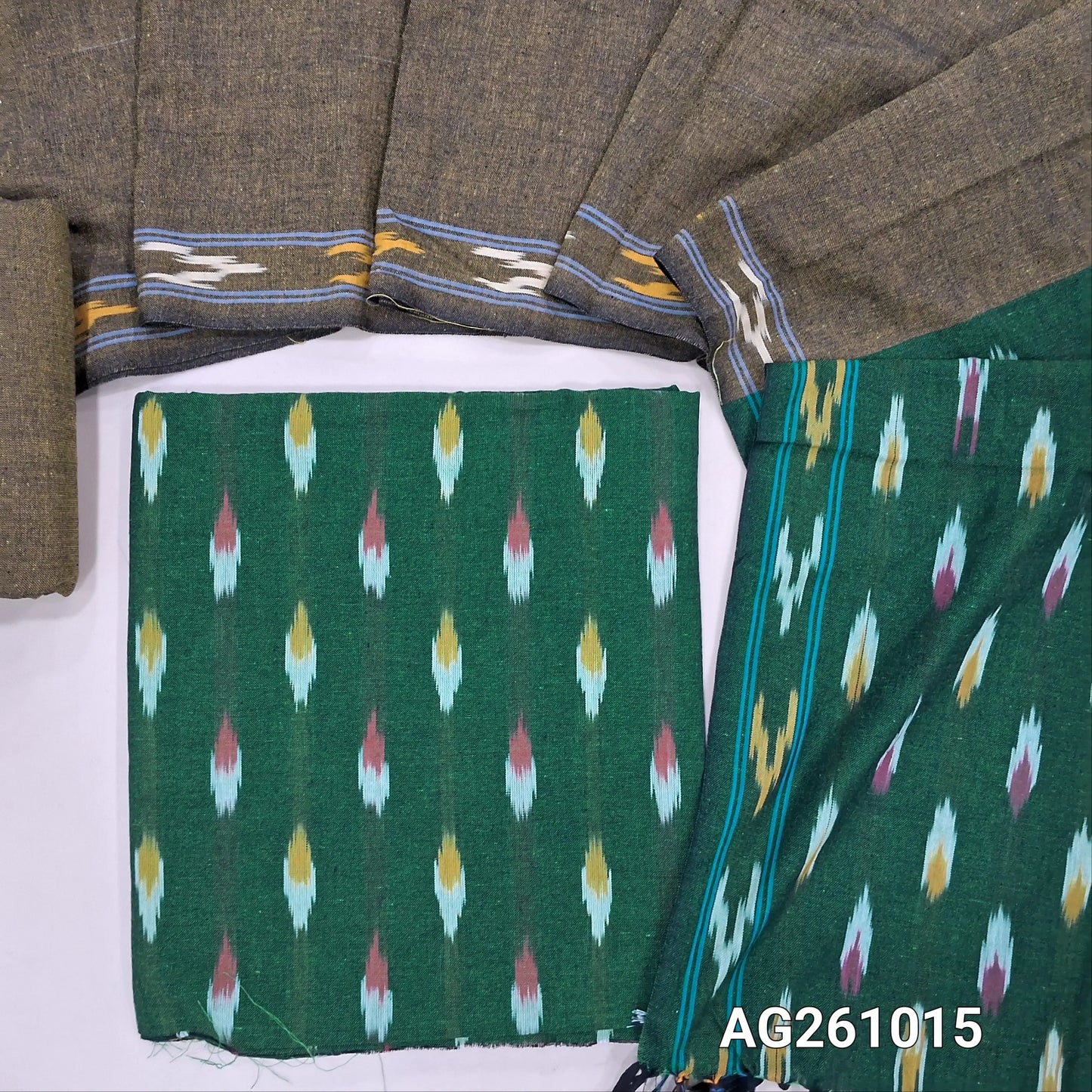 Bottle green premium ikat woven handloom cotton unstitched salwar material, (lining optional)mehandhi green cotton bottom, dual shaded handloom cotton dupatta with borders and tassles(INCONSISTENT WEAVING ARE NOT DEFECTS) . AG261015