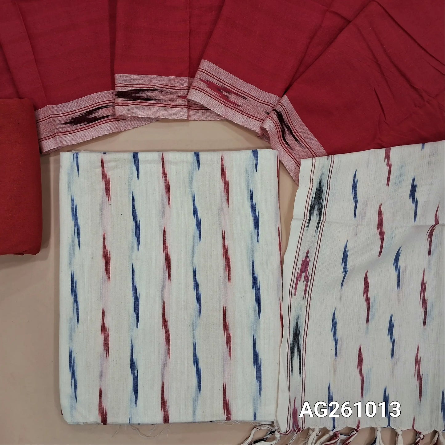 Off white premium ikat woven handloom cotton unstitched salwar material, (lining optional)red cotton bottom, dual shaded handloom cotton dupatta with borders and tassles(INCONSISTENT WEAVING ARE NOT DEFECTS). AG261013