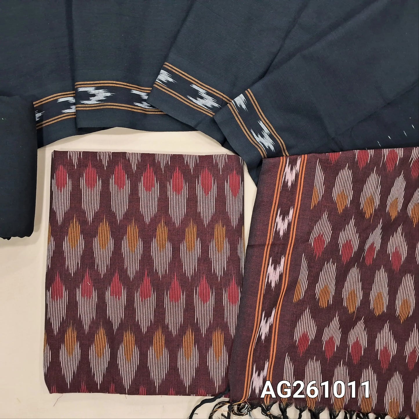 Dark maoon premium ikat woven handloom cotton unstitched salwar material, (lining optional)black cotton bottom, dual shaded handloom cotton dupatta with borders and tassles(INCONSISTENT WEAVING ARE NOT DEFECTS). AG261011