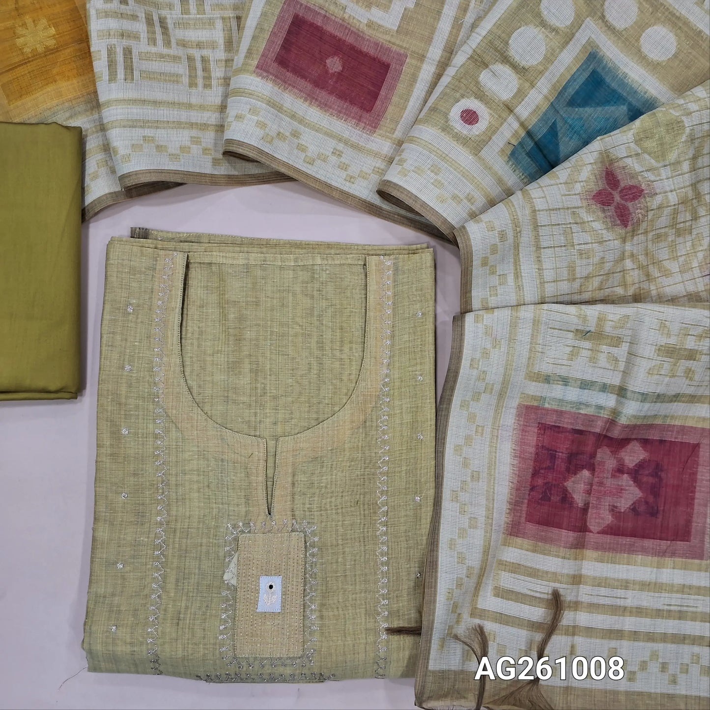 Designer yellowish green silk cotton unstitched salwar material,zari detailing and applique on yoke,(Lining Needed)silky bottom, abstract jamdani woven silk cotton dupatta. AG261008