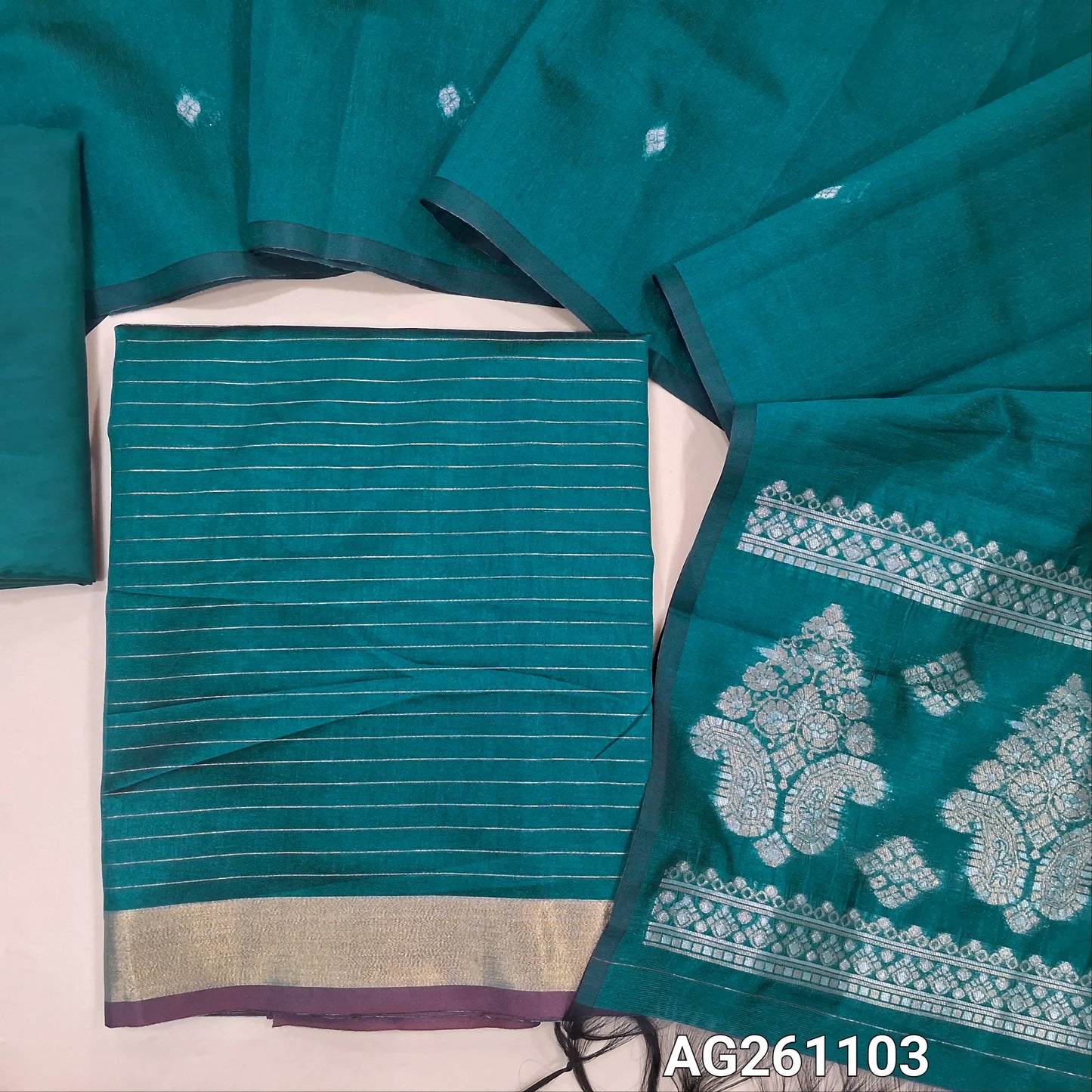 Teal blue silk cotton unstitched salwar material,zari lines all over,(Lining Needed)silky bottom, benarsi zari woven on full length silk cotton dupatta with rich gold and silver zari pallu. AG261103
